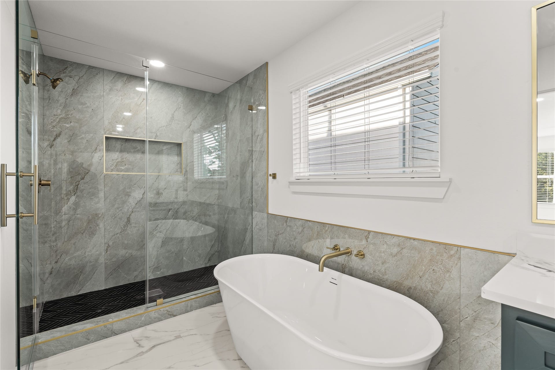 4702 Rawley Street, Houston, TX 77020 Melt the stress away. The deep, freestanding soaking tub sits perfectly beneath the window, creating your own private oasis for relaxation.