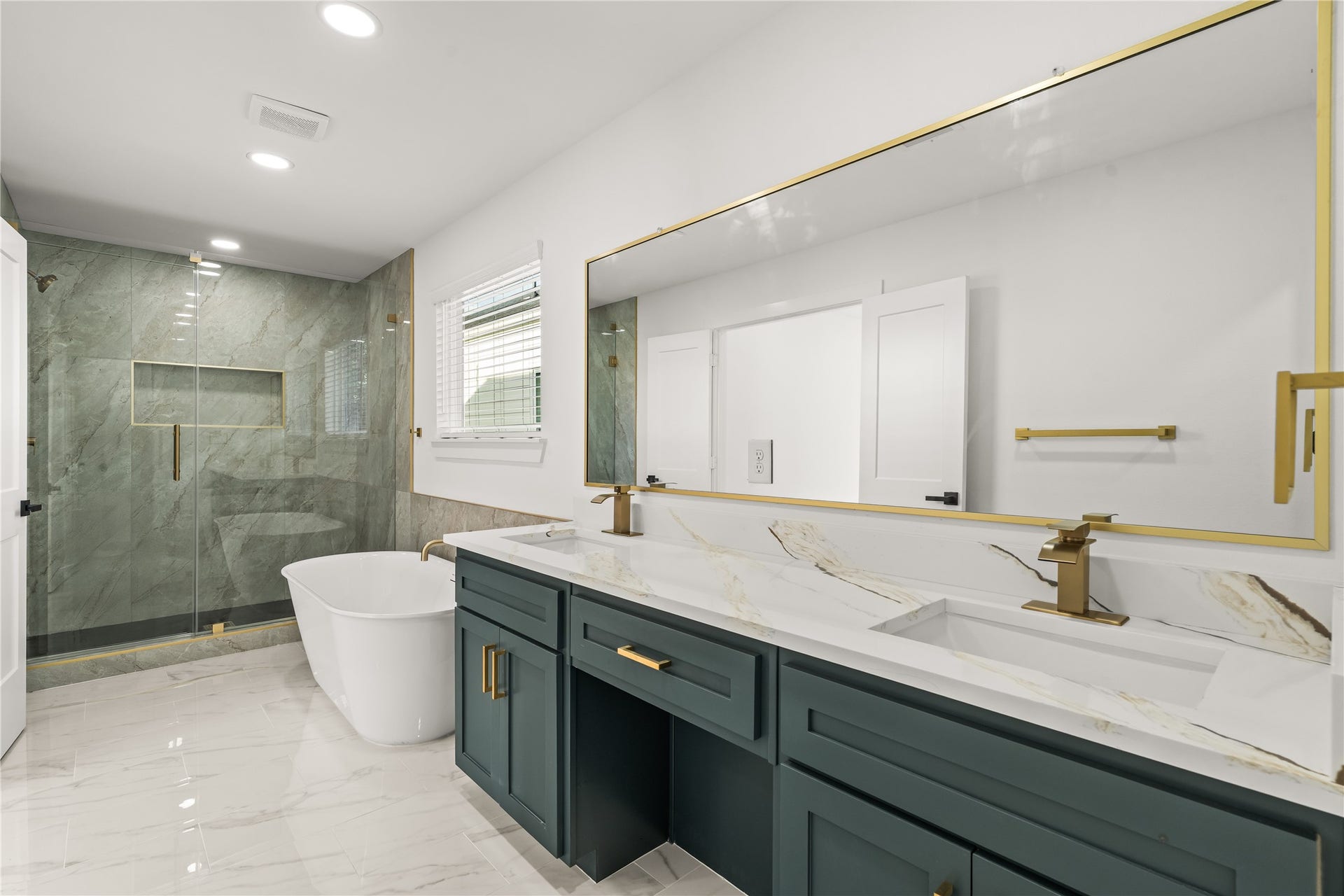 4702 Rawley Street, Houston, TX 77020 Spa-day luxury, every single day. The primary ensuite boasts an expansive double vanity, an ultra-modern standalone soaking tub, and a massive glass-enclosed shower.