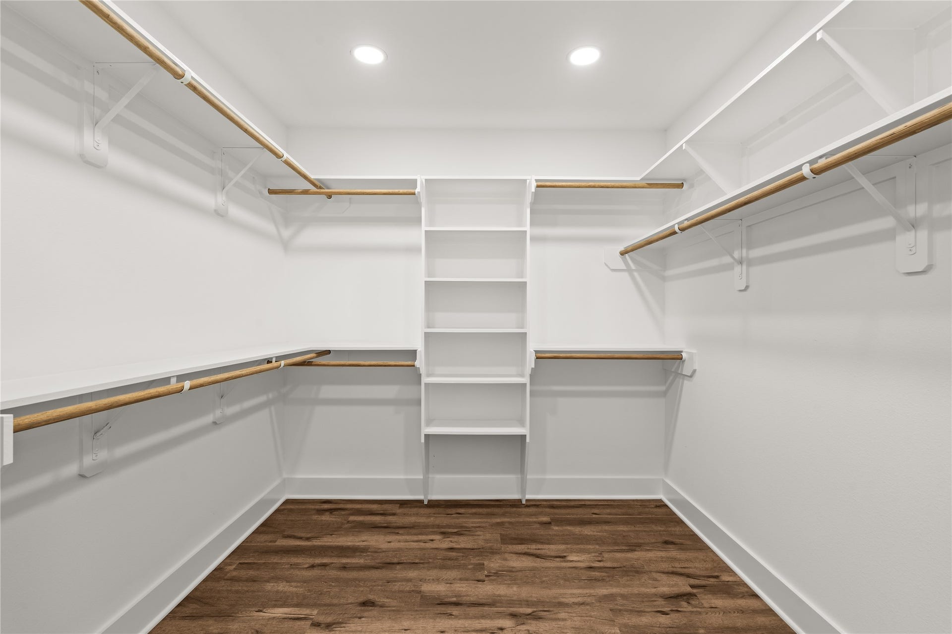 4702 Rawley Street, Houston, TX 77020 A wardrobe enthusiast's dream. The primary walk-in closet comes fully equipped with wrap-around custom built-ins, open shelving, and multi-level hanging rods.