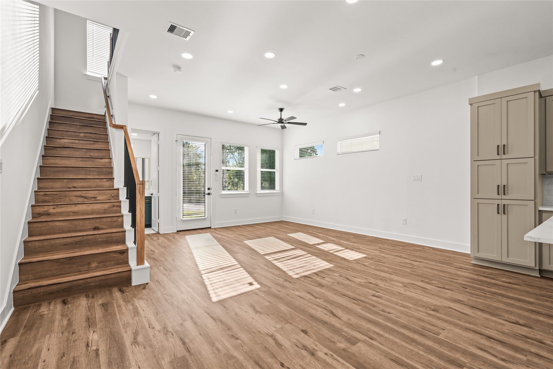 4702 Rawley Street, Houston, TX 77020 Sprawling layout, infinite possibilities. This commanding viewpoint shows how the entire main floor harmonizes, effortlessly connecting the entrance, storage hubs, and upper levels.