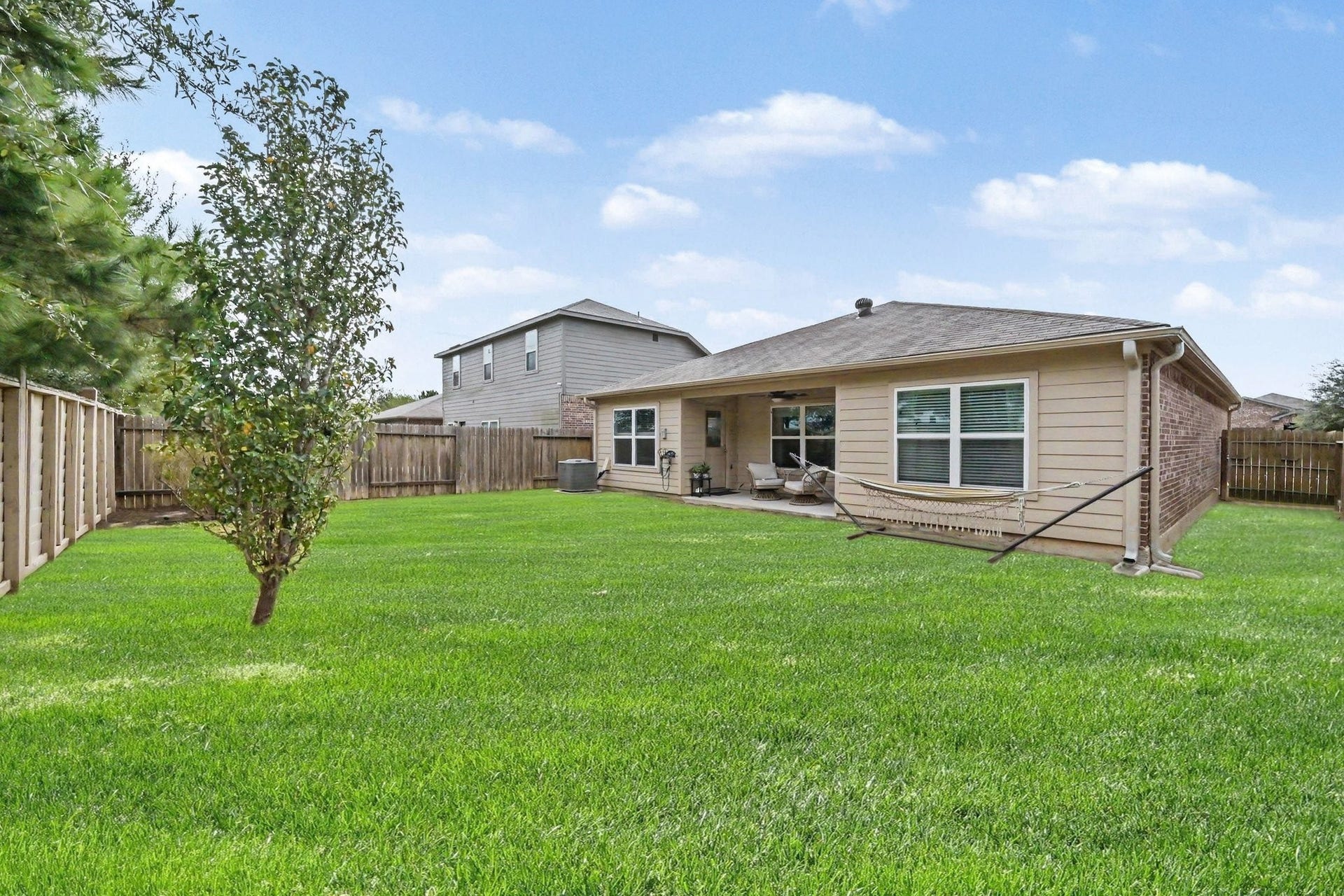 949 Texas Timbers Drive, Katy, TX 77493 Generous backyard space with plenty of room for play, gardening, or outdoor activities