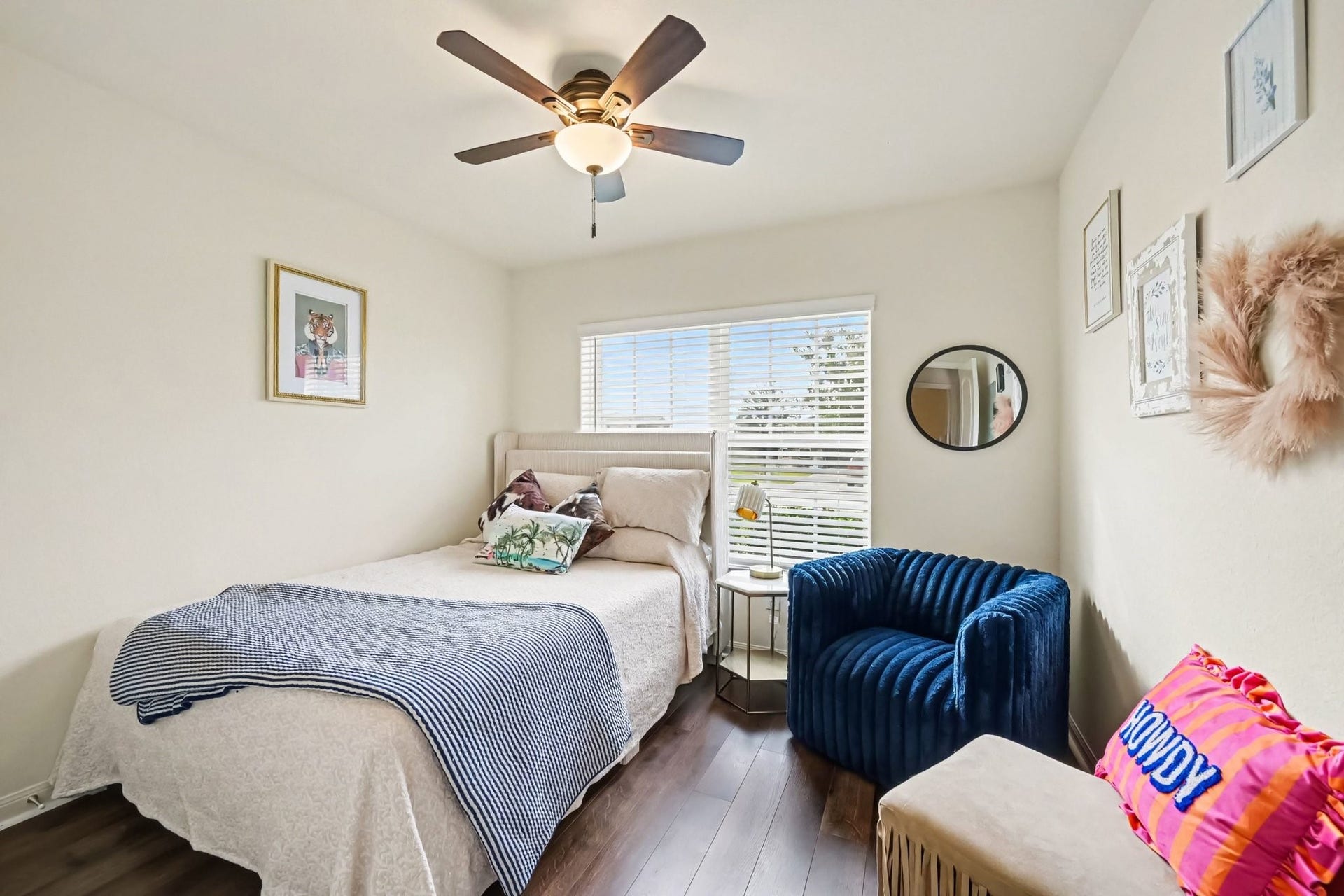 949 Texas Timbers Drive, Katy, TX 77493 Bright secondary bedroom located at the front of the home with plank laminate flooring