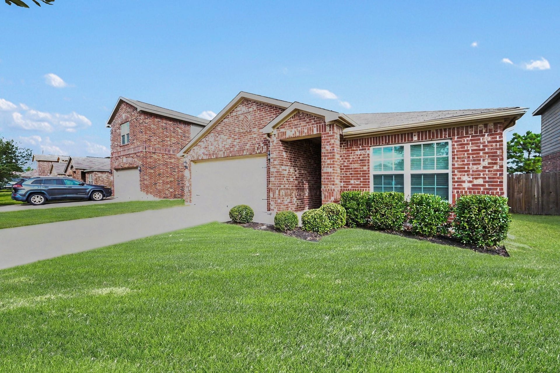 949 Texas Timbers Drive, Katy, TX 77493 Alternate front view showcasing the home's charming curb appeal and spacious lot