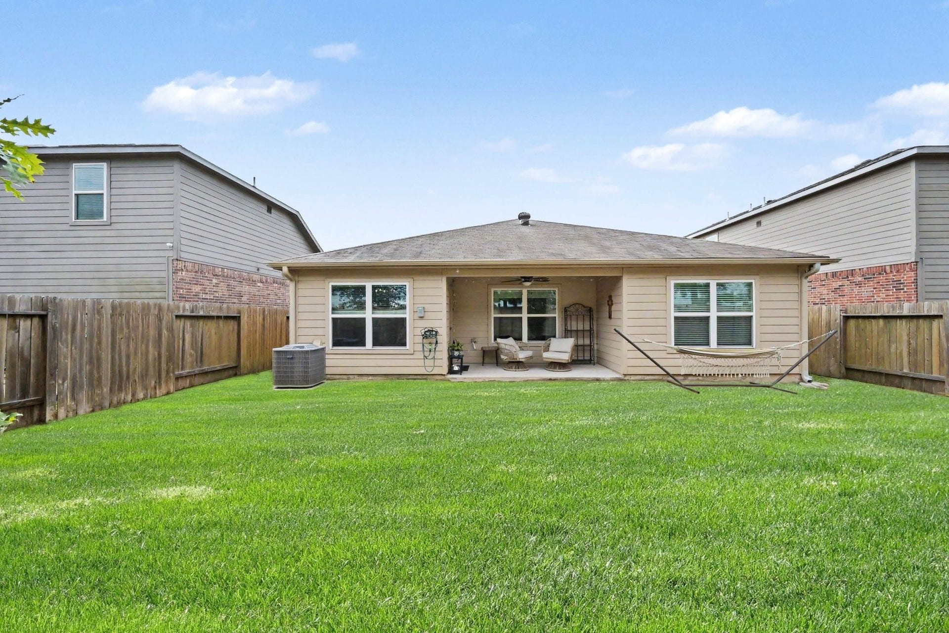 949 Texas Timbers Drive, Katy, TX 77493 Rear view of the home showcasing the spacious backyard