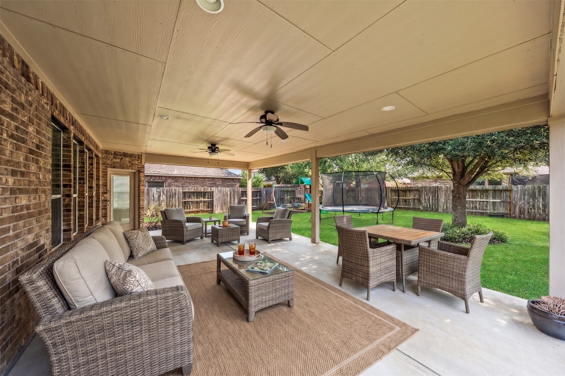 10014 Forrester Trail, Katy, TX 77494 The covered patio is huge and faces east for loads of shade! Virtually staged photo.