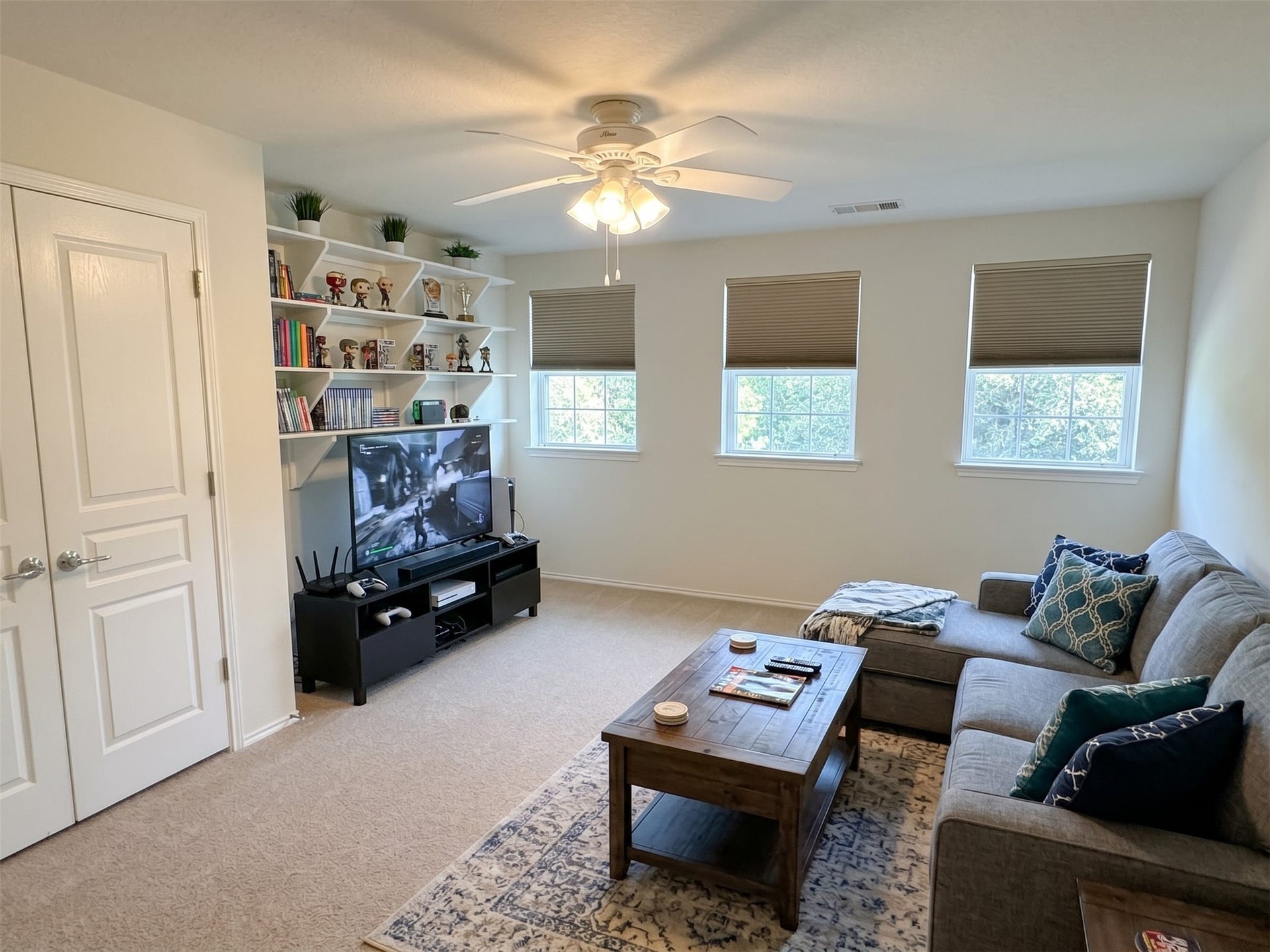 10014 Forrester Trail, Katy, TX 77494 The game room is located at the top of the stairs, features a full closet if you need a 6th bedroom. Virtually staged photo.
