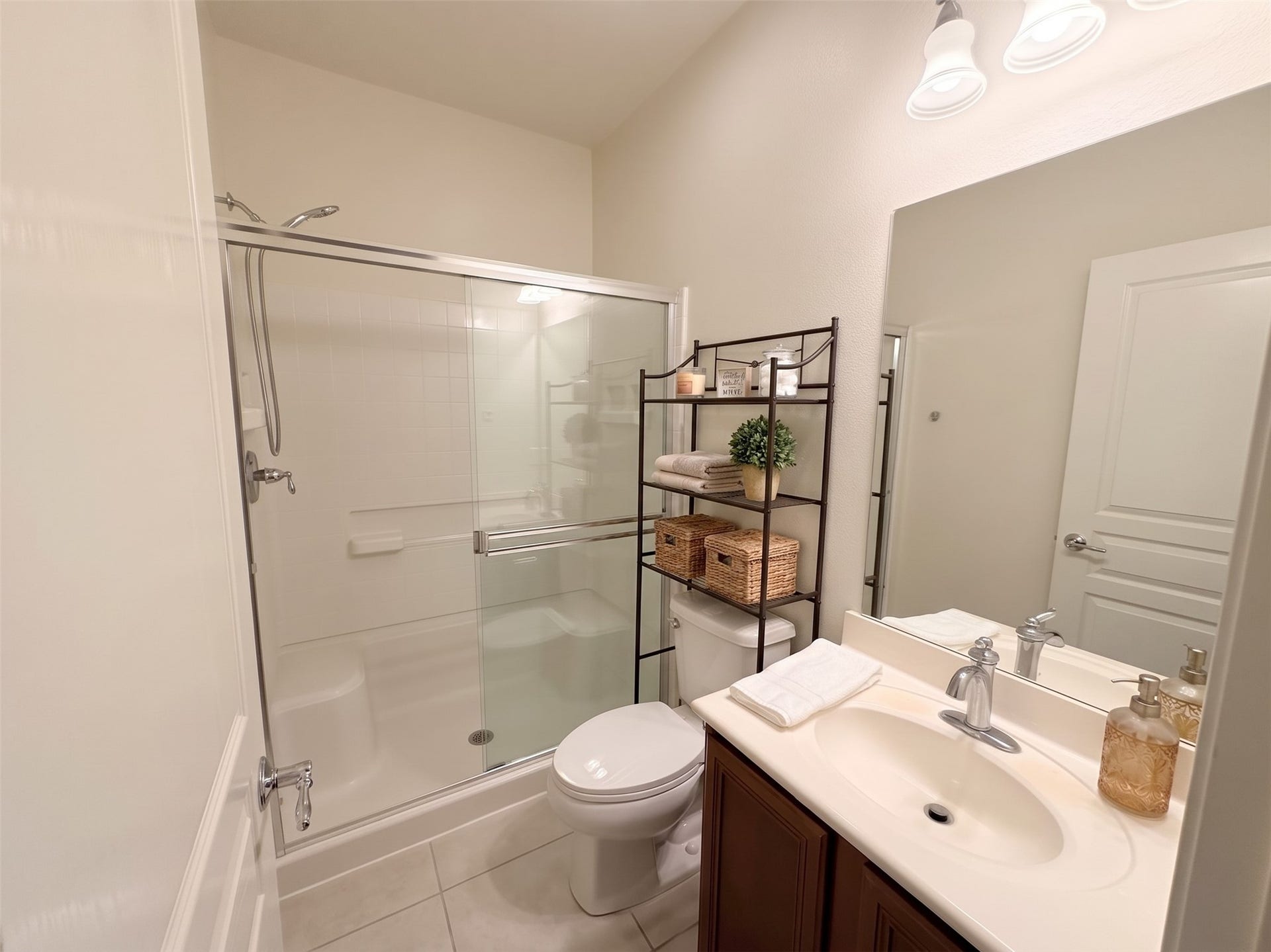 10014 Forrester Trail, Katy, TX 77494 This full bath downstairs is convenient to the home office/bedroom downstairs. Virtually staged photo. Freshly painted.