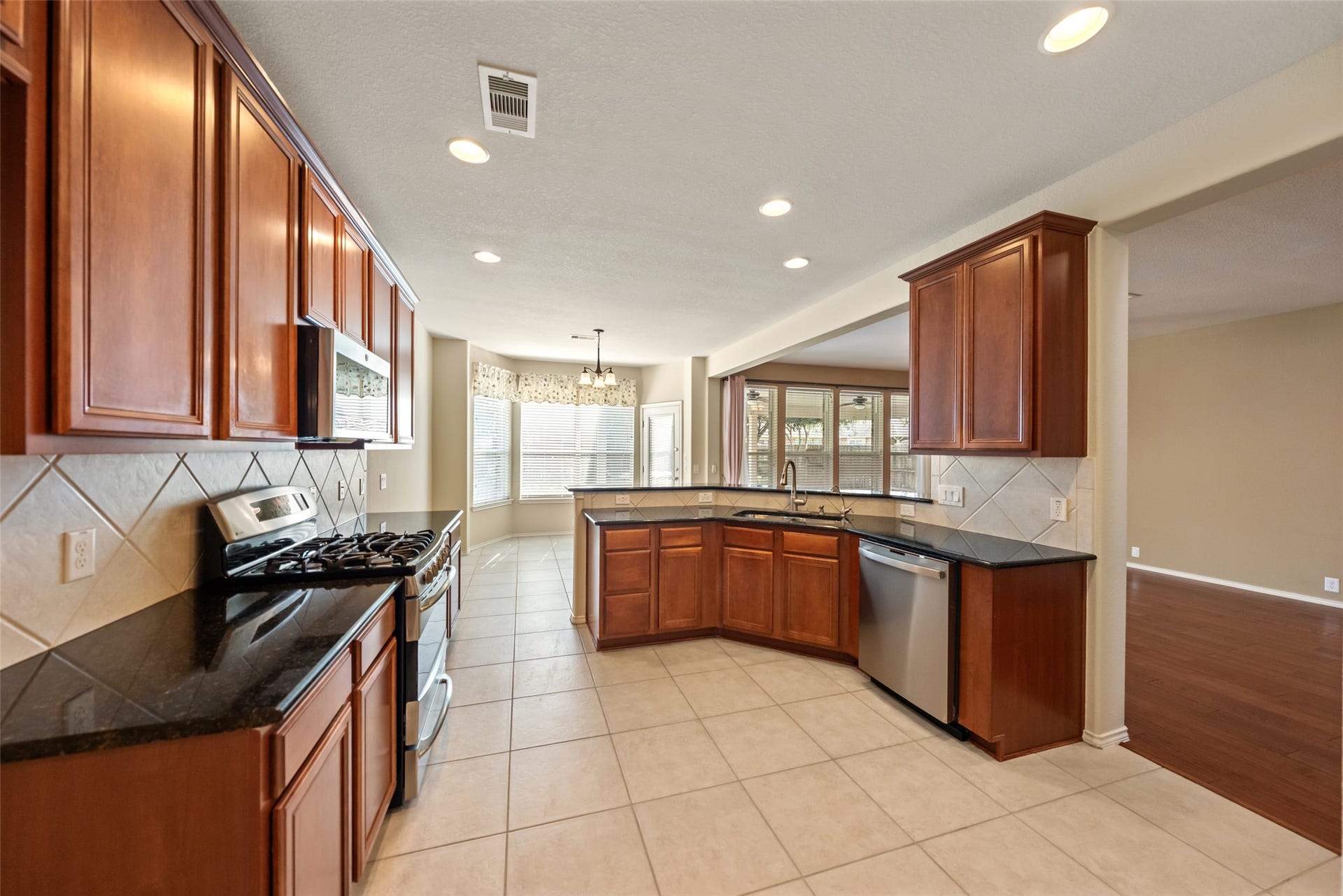 10014 Forrester Trail, Katy, TX 77494 The kitchen features granite counters, SS appliances, and loads of cabinet space.