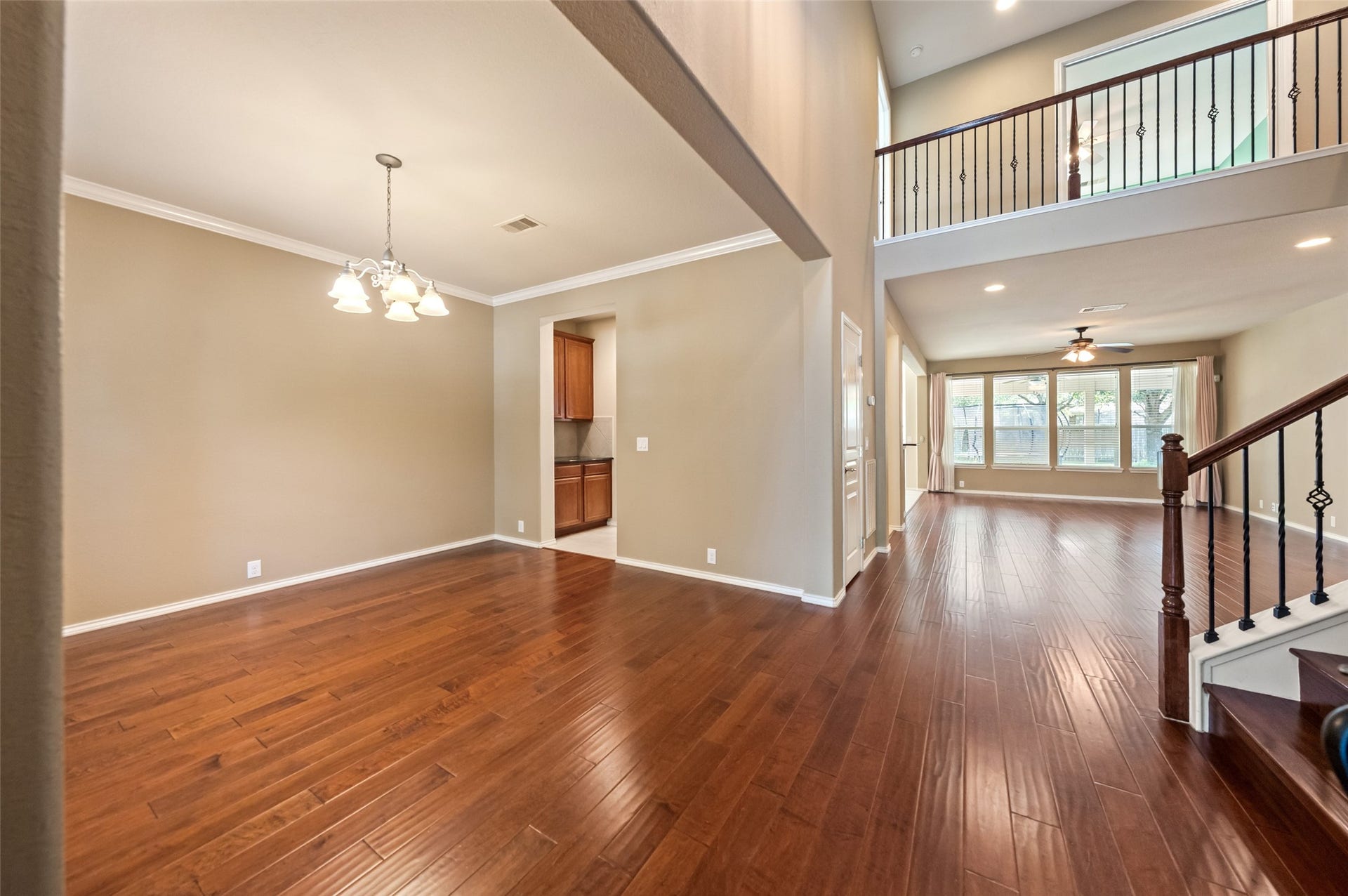 10014 Forrester Trail, Katy, TX 77494 Gleaming wood flooring spans across the entry, dining room, living room, and 5th bedroom/home office.