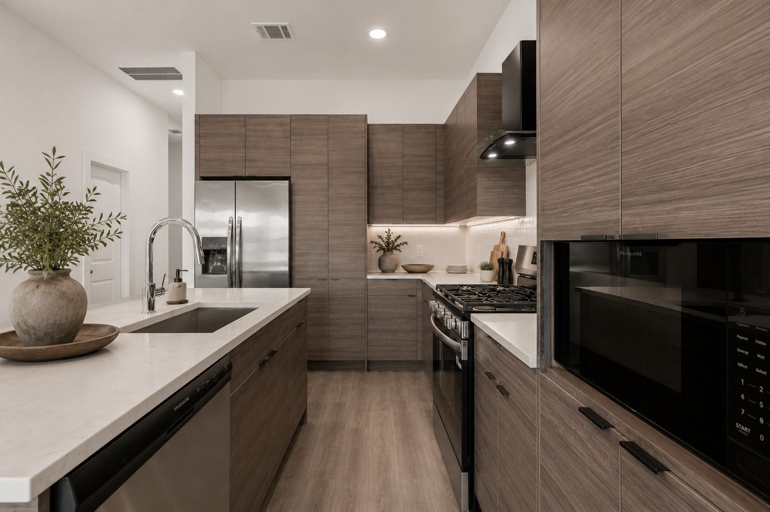 13511 Ivy Vine Lane, Houston, TX 77047 Contemporary island kitchen featuring quartz countertops, stainless steel appliances, soft-close cabinetry, and modern designer finishes throughout.