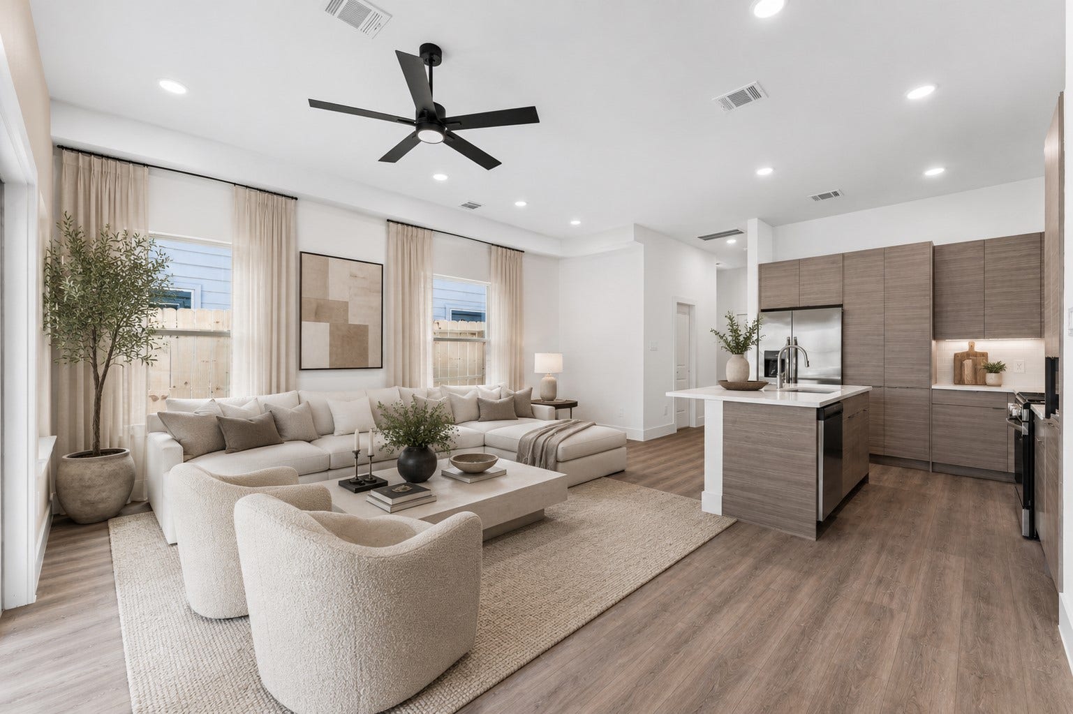13511 Ivy Vine Lane, Houston, TX 77047 Open-concept living designed for connection, featuring elevated ceilings, abundant natural light, and seamless flow into the kitchen and dining spaces.