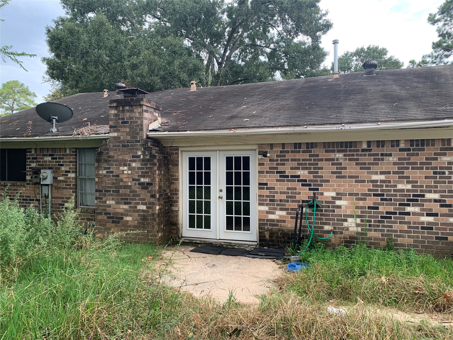 23830 English Oak Drive, Spring, TX 77373 Backyard with French Doors and panel.
