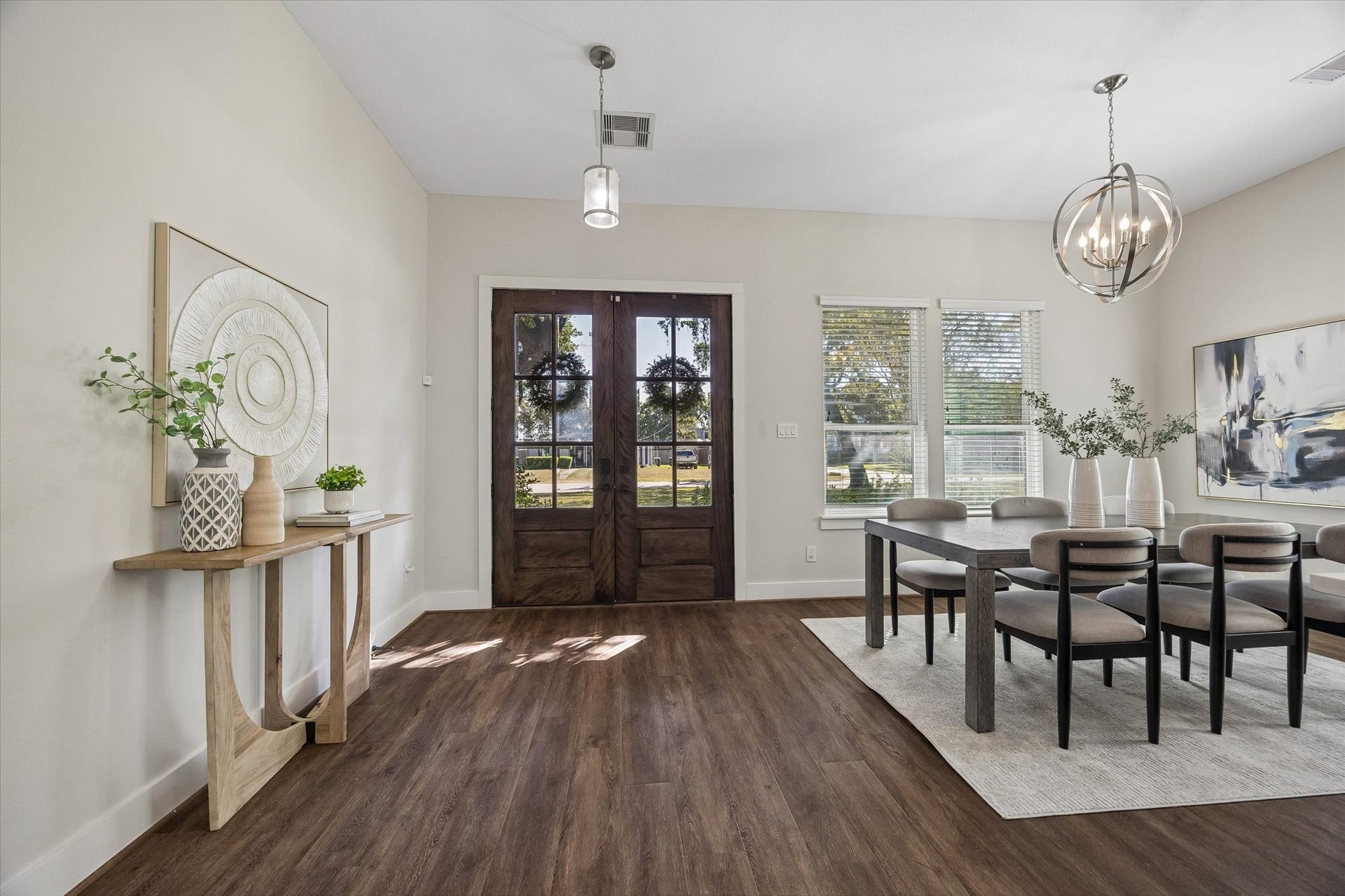 702 W 41st Street, Houston, TX 77018 Welcome home! Beautiful double entry doors open to bright, inviting interiors with 10' ceilings, fresh neutral finishes, stylish lighting and updated luxury vinyl tile flooring.