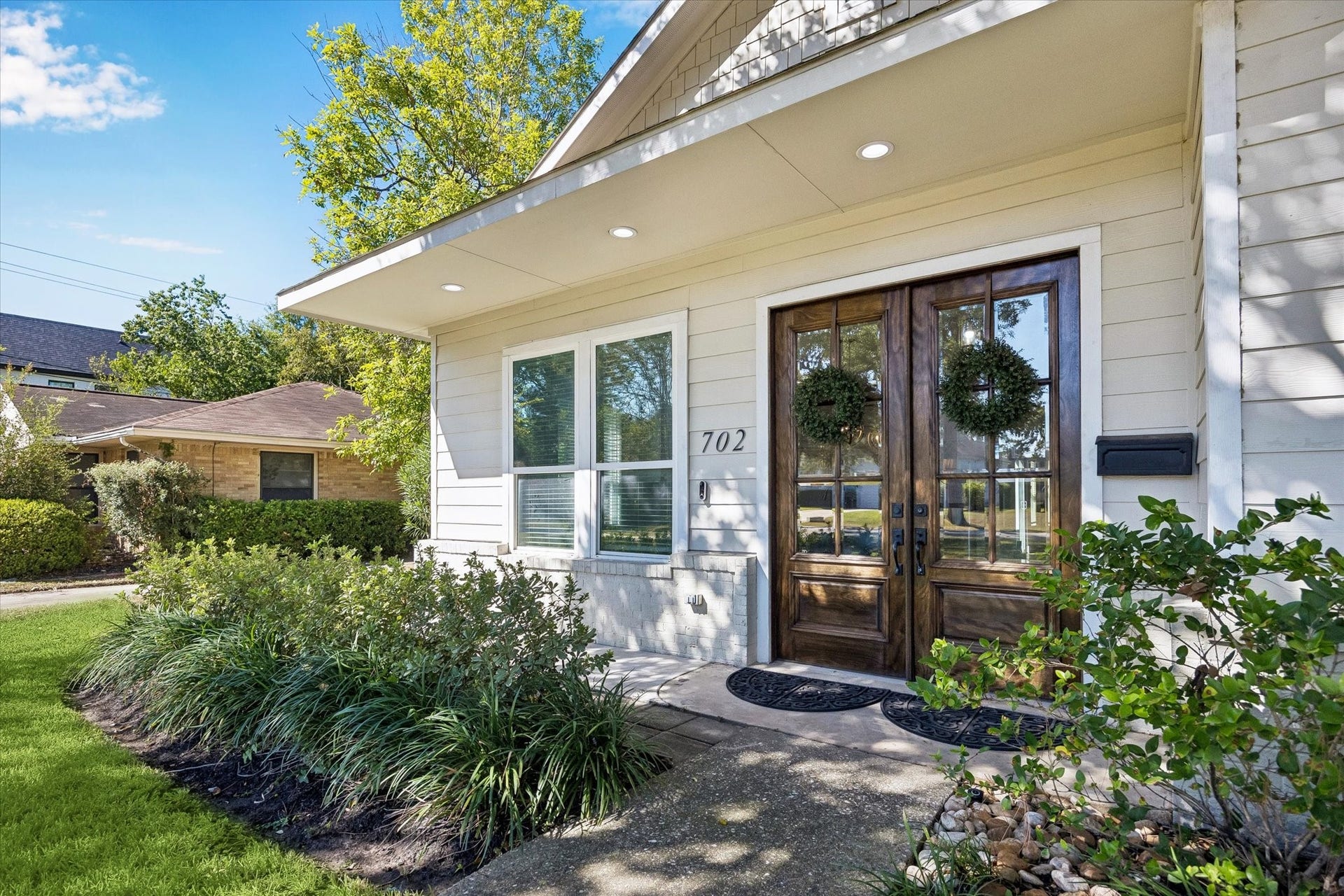 702 W 41st Street, Houston, TX 77018 Behind these beautiful double doors, you'll find bright, open living spaces, a gorgeous island kitchen, four bedrooms including two primary suites and thoughtful updates throughout. Outside, a private patio, covered entertaining area, towering shade trees and lush green lawn offer plenty of room to relax and enjoy the outdoors. From lively gatherings with family and friends to quiet evenings at home, there's room to make memories that last a lifetime.