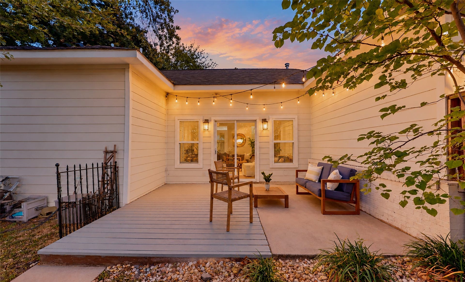 702 W 41st Street, Houston, TX 77018 As dusk settles in, this charming private patio becomes the perfect place to unwind after a long day. Whether you're sharing a glass of wine with friends or enjoying a quiet evening under the stars, you'll love having this cozy outdoor retreat just steps from home.
