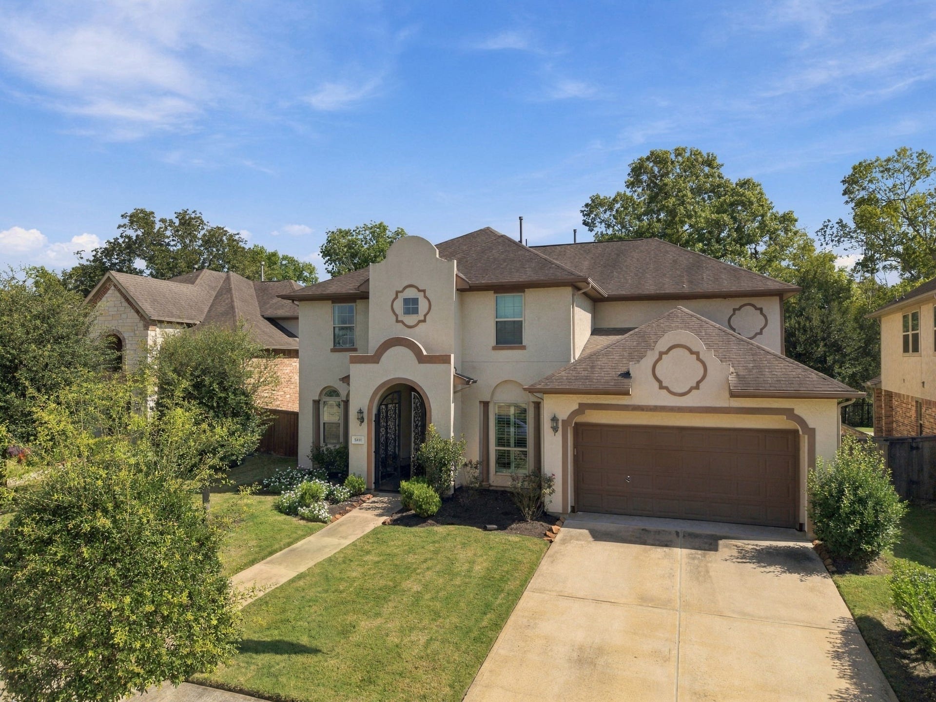 5411 Oban Terrace Lane, Sugar Land, TX 77479 This attractive residence stands out with its decorative stucco accents, arched front doorway, and thoughtfully maintained outdoor surroundings.