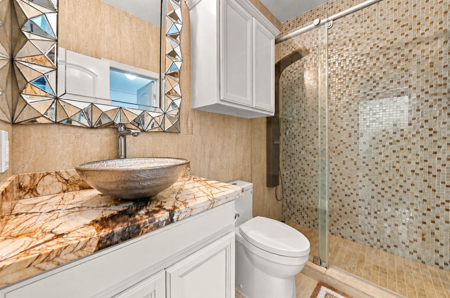 5411 Oban Terrace Lane, Sugar Land, TX 77479 Give your guests the convenience of their own bathroom, complete with a modern and upgraded walk-in shower and attractive tilework for a comfortable stay.