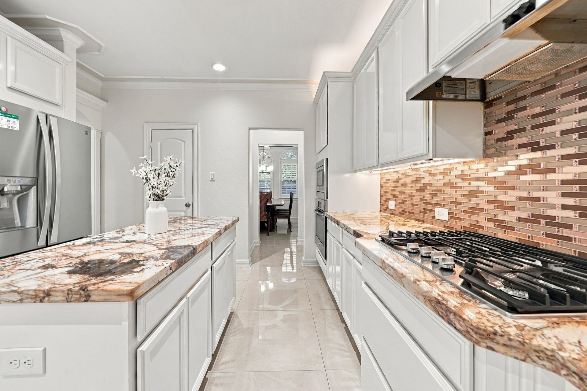 5411 Oban Terrace Lane, Sugar Land, TX 77479 Just a few steps from the kitchen to the dining table, this thoughtful layout brings comfort and convenience to every gathering.