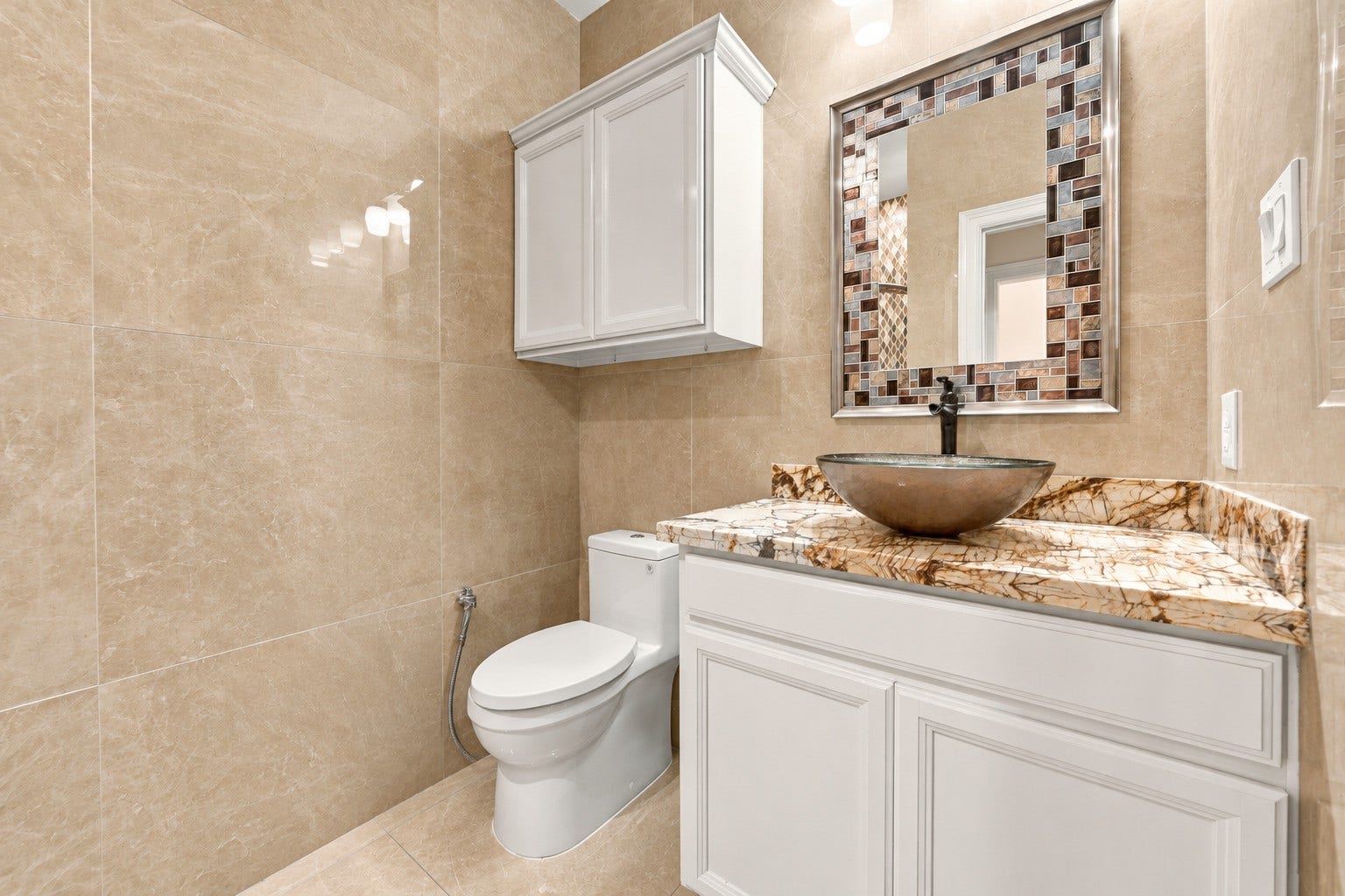 5411 Oban Terrace Lane, Sugar Land, TX 77479 Enjoy a bathroom that goes beyond the basics, featuring a glass-enclosed walk-in shower with a modern shower panel and stylish finishes that add comfort and elegance to your daily routine.
