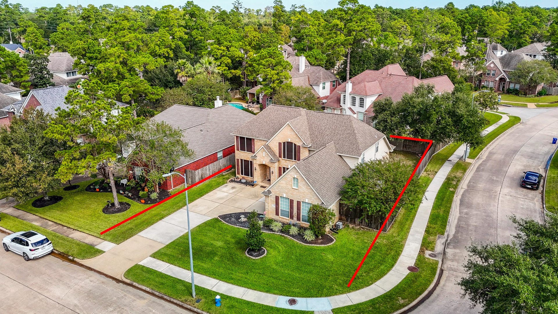 Beautifully situated along a gently curving street, this home enjoys a prominent corner location with an attractive lawn, mature landscaping, and a welcoming residential setting.