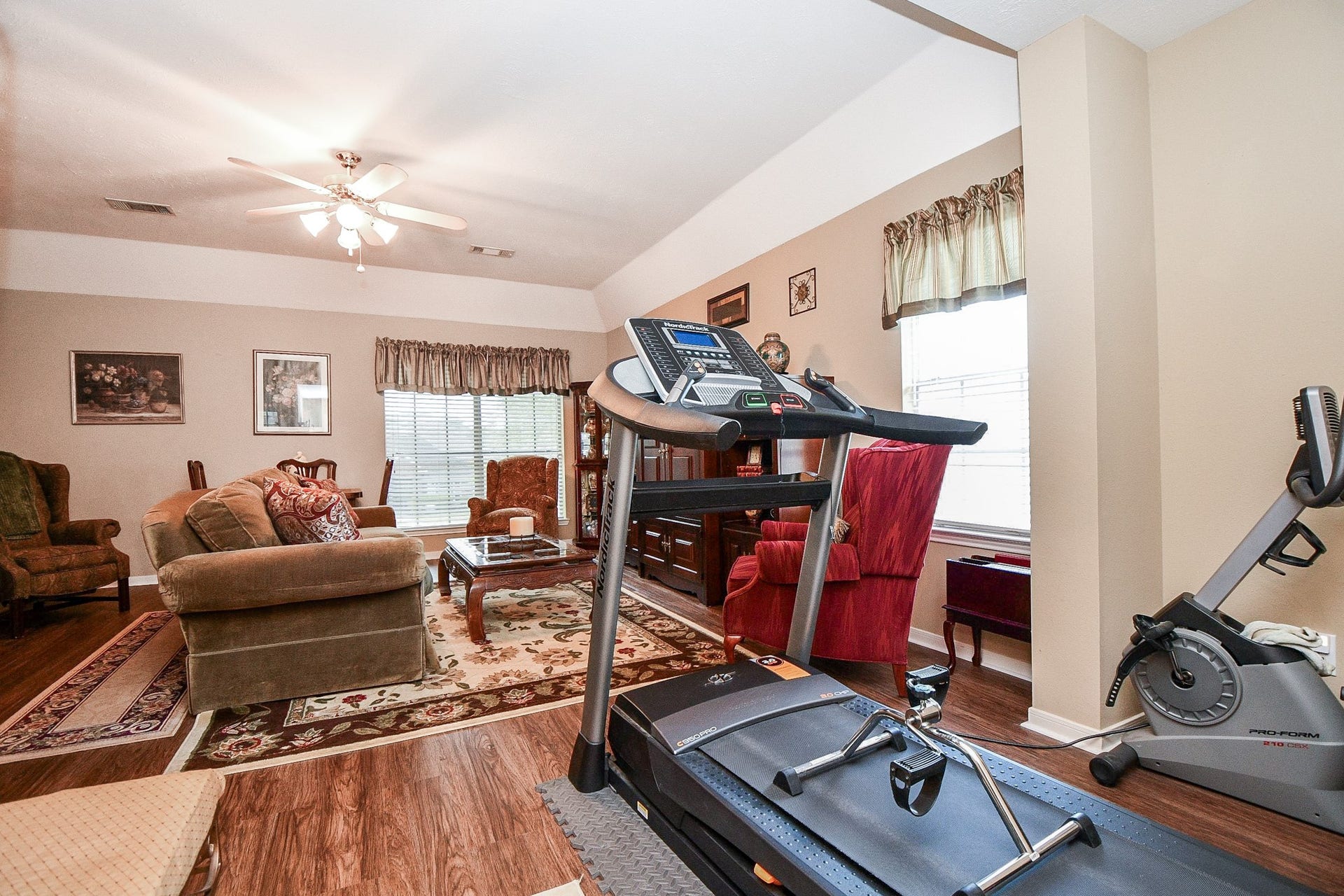 Why leave home for your workout when you have room to create your own fitness space? This expansive upstairs game room offers the flexibility to combine exercise, entertainment and relaxation in one versatile area.