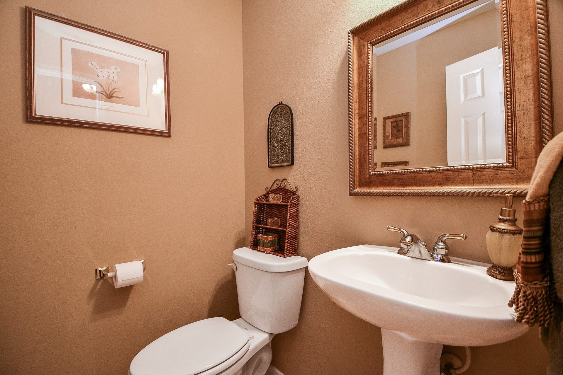 Thoughtfully located near the main living areas, this convenient powder bath makes entertaining easy, giving guests their own space while keeping the home's private bathrooms separate.