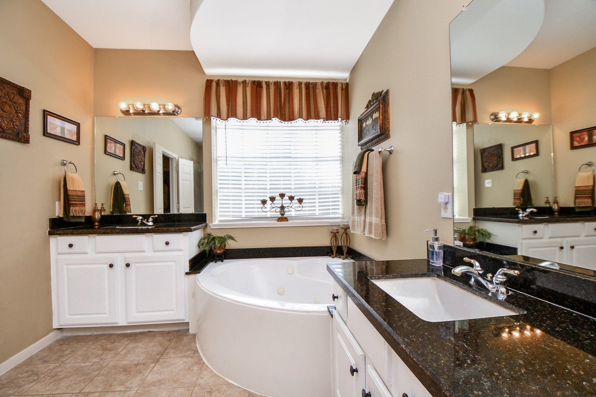 A little relaxation goes a long way. Unwind in the corner soaking tub after a busy day, or enjoy the convenience of separate vanities with granite countertops and plenty of room for your morning routines.