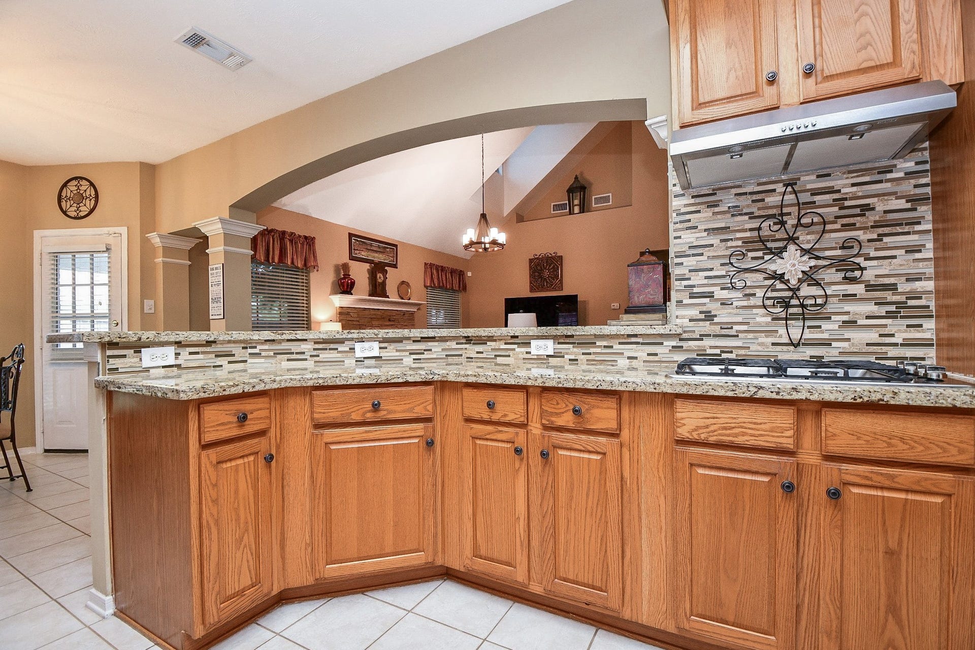 The kitchen may be where the cooking happens, but it's also where everyone loves to gather! An open pass-through connects the kitchen to the family room, keeping conversation flowing and making entertaining feel effortless.