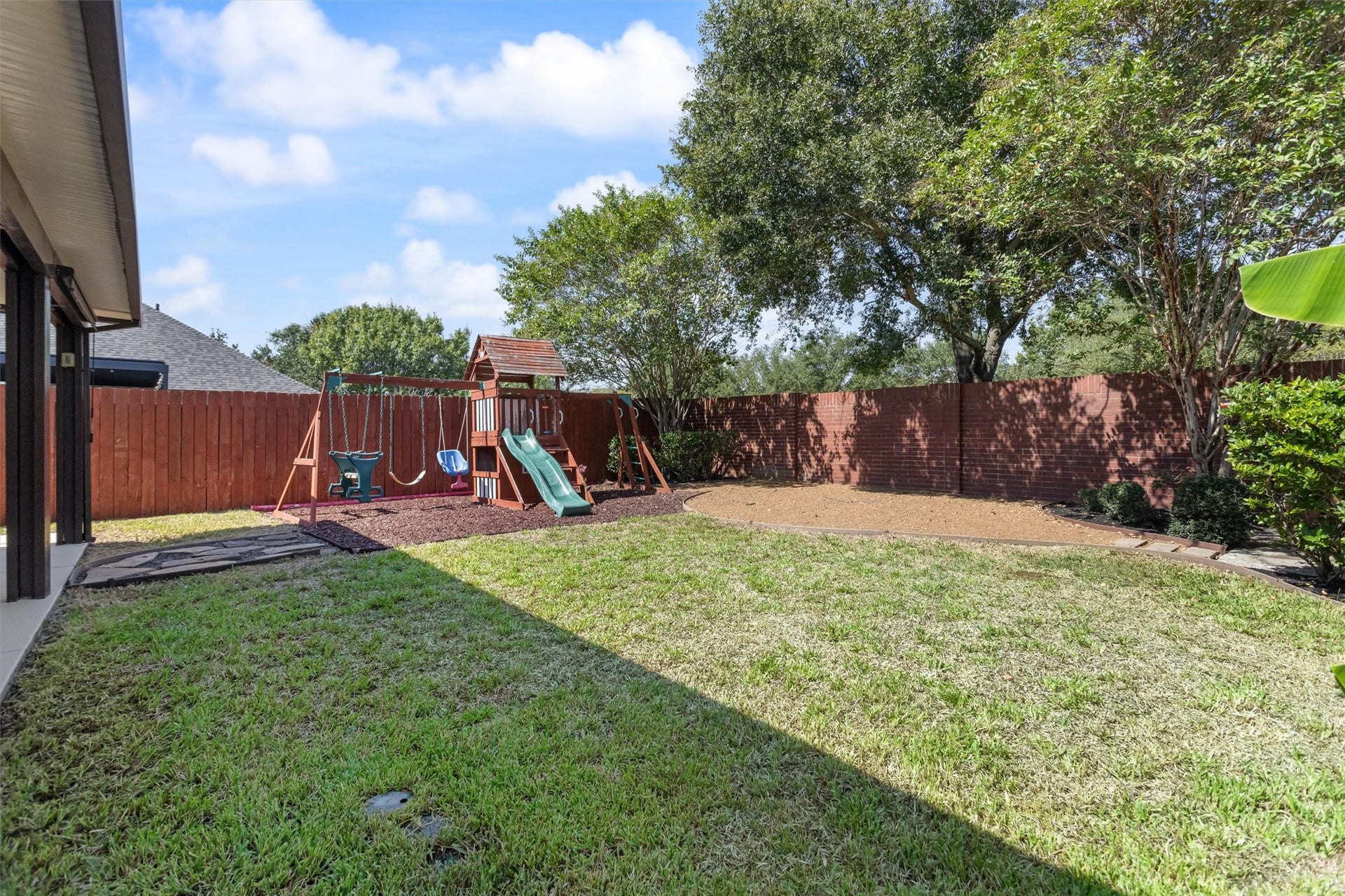 20514 Rustic Rail Court, Cypress, TX 77433 Great use of back yard space with designated areas for gardening, lawn and play areas. Playset included