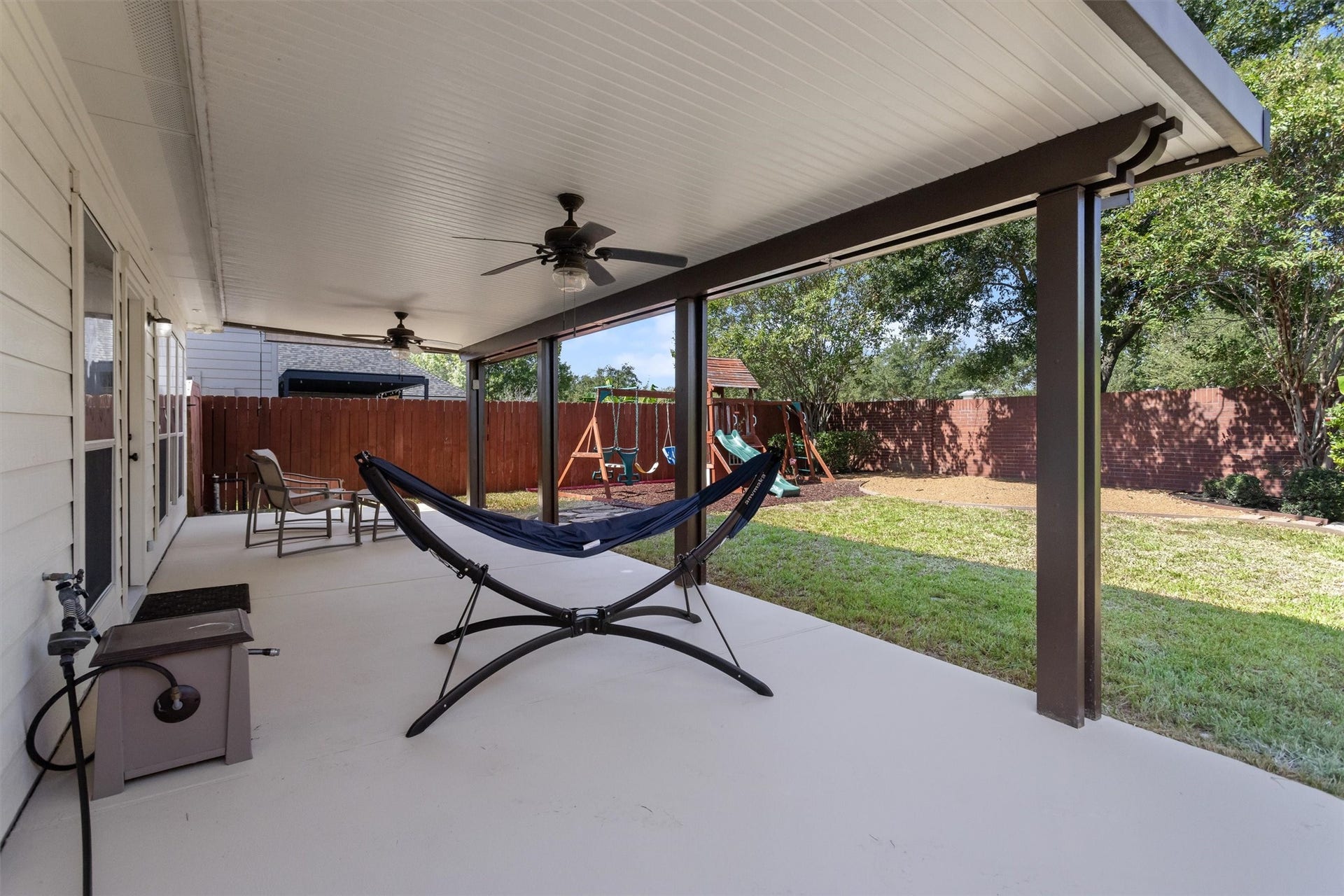 20514 Rustic Rail Court, Cypress, TX 77433 Back patio has double ceiling fans. Perfect for outdoor entertaining and an outdoor kitchen