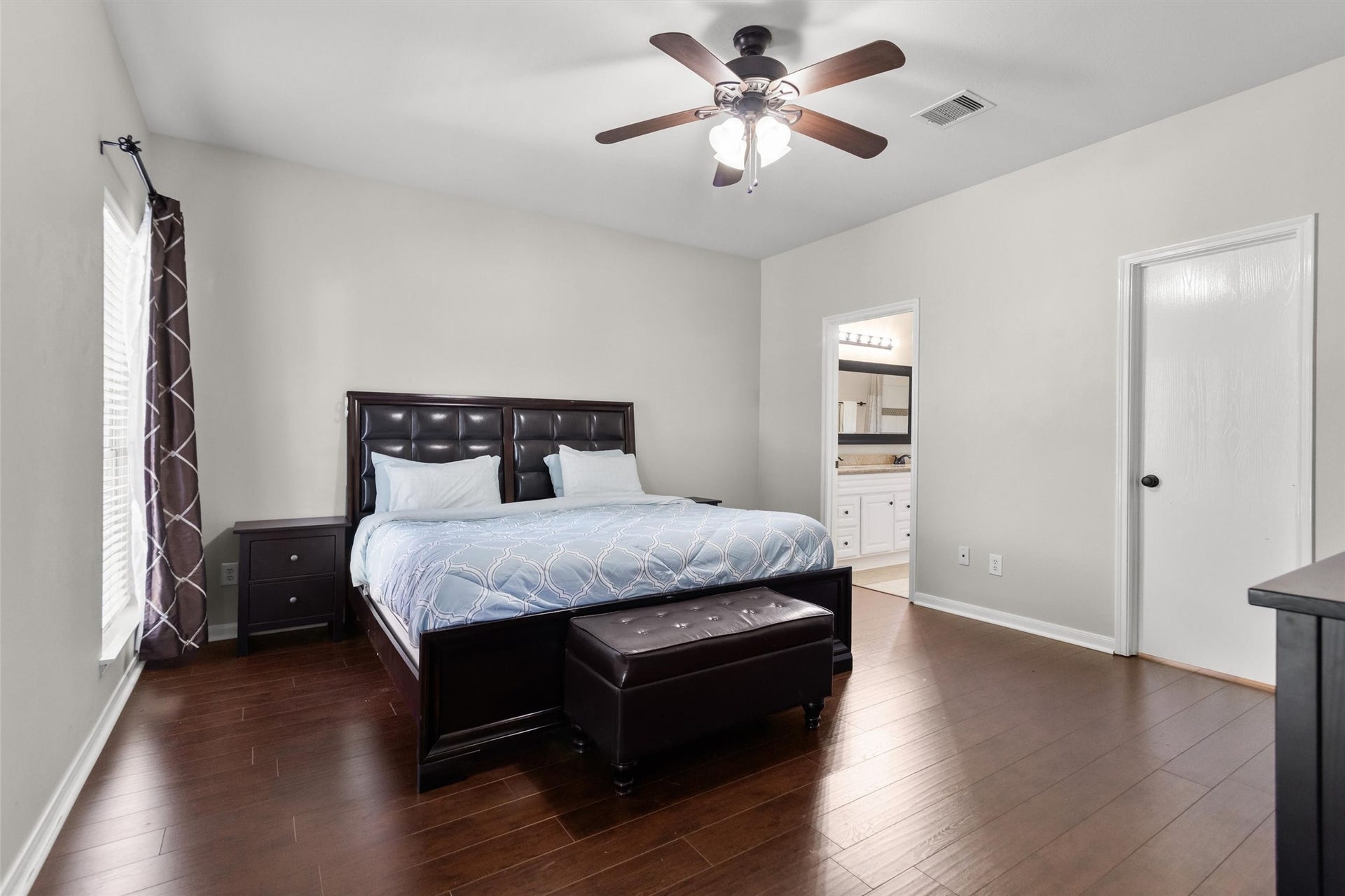 20514 Rustic Rail Court, Cypress, TX 77433 Spacious primary bedroom on the 1st floor with laminate wood floors