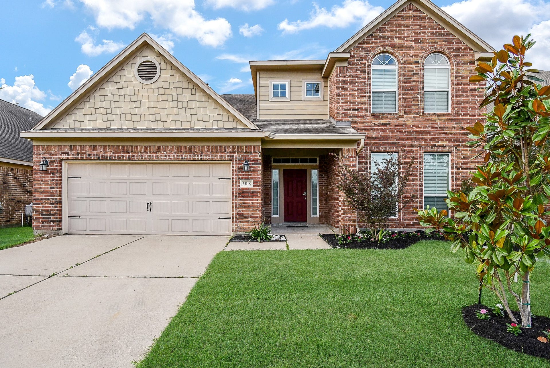 23118 Quiet Heron Court, Katy, TX 77493 This charming two-story brick home features a 2 car garage, well-maintained lawn, and inviting entryway. Perfect for families seeking a spacious and welcoming space.