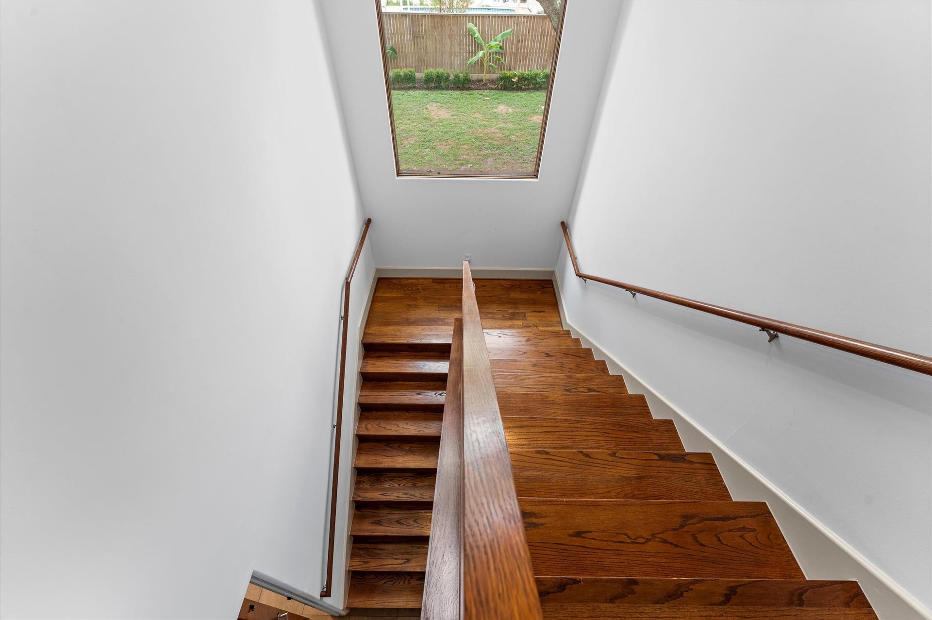 5135 Longmont Drive, Houston, TX 77056 A secondary staircase accessed from the mudroom provides convenient circulation to the upstairs bedroom areas, adding functionality to the home's thoughtful floor plan.