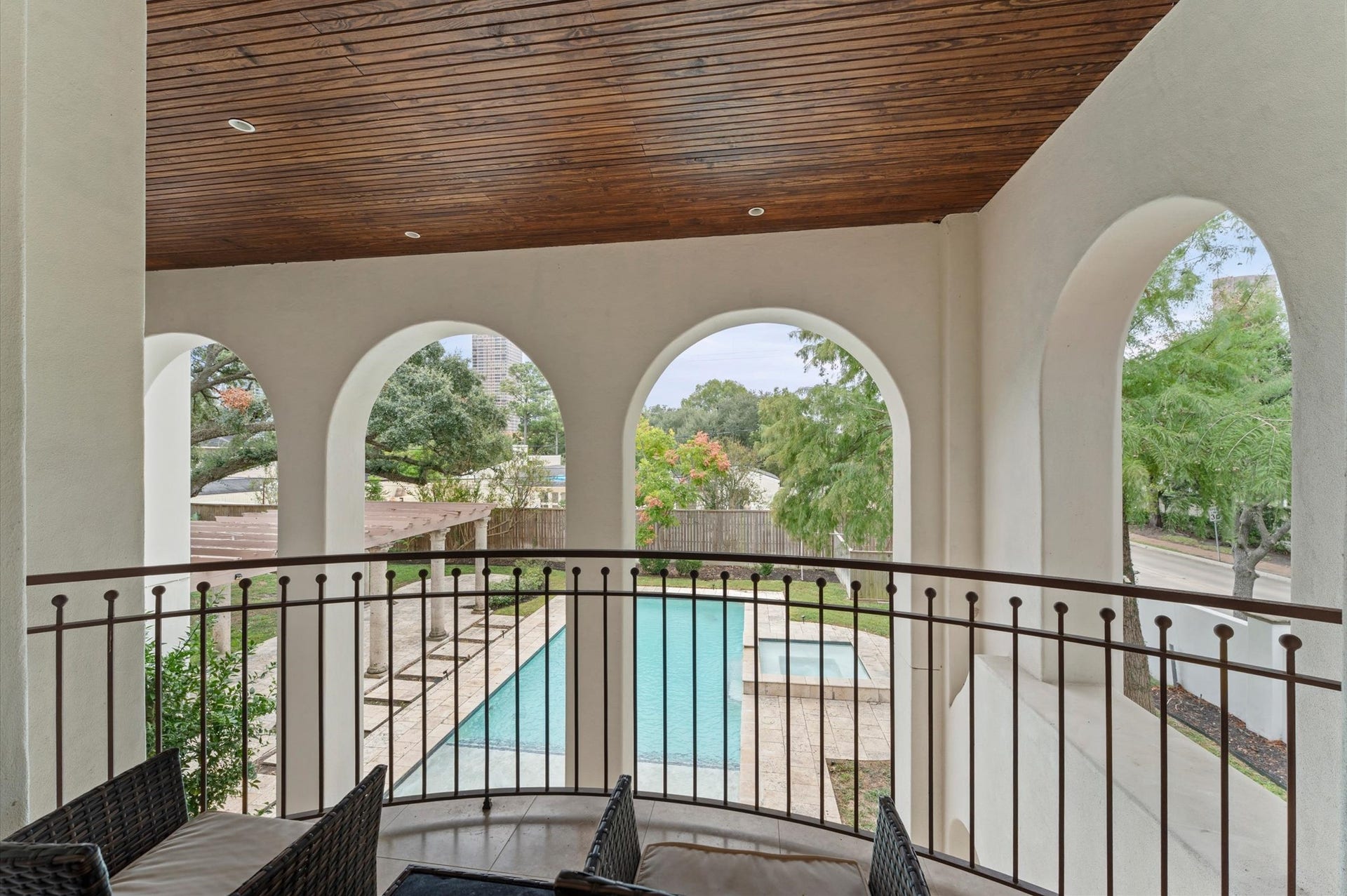 5135 Longmont Drive, Houston, TX 77056 A private primary suite balcony offers an elevated outdoor retreat overlooking the estate grounds.
