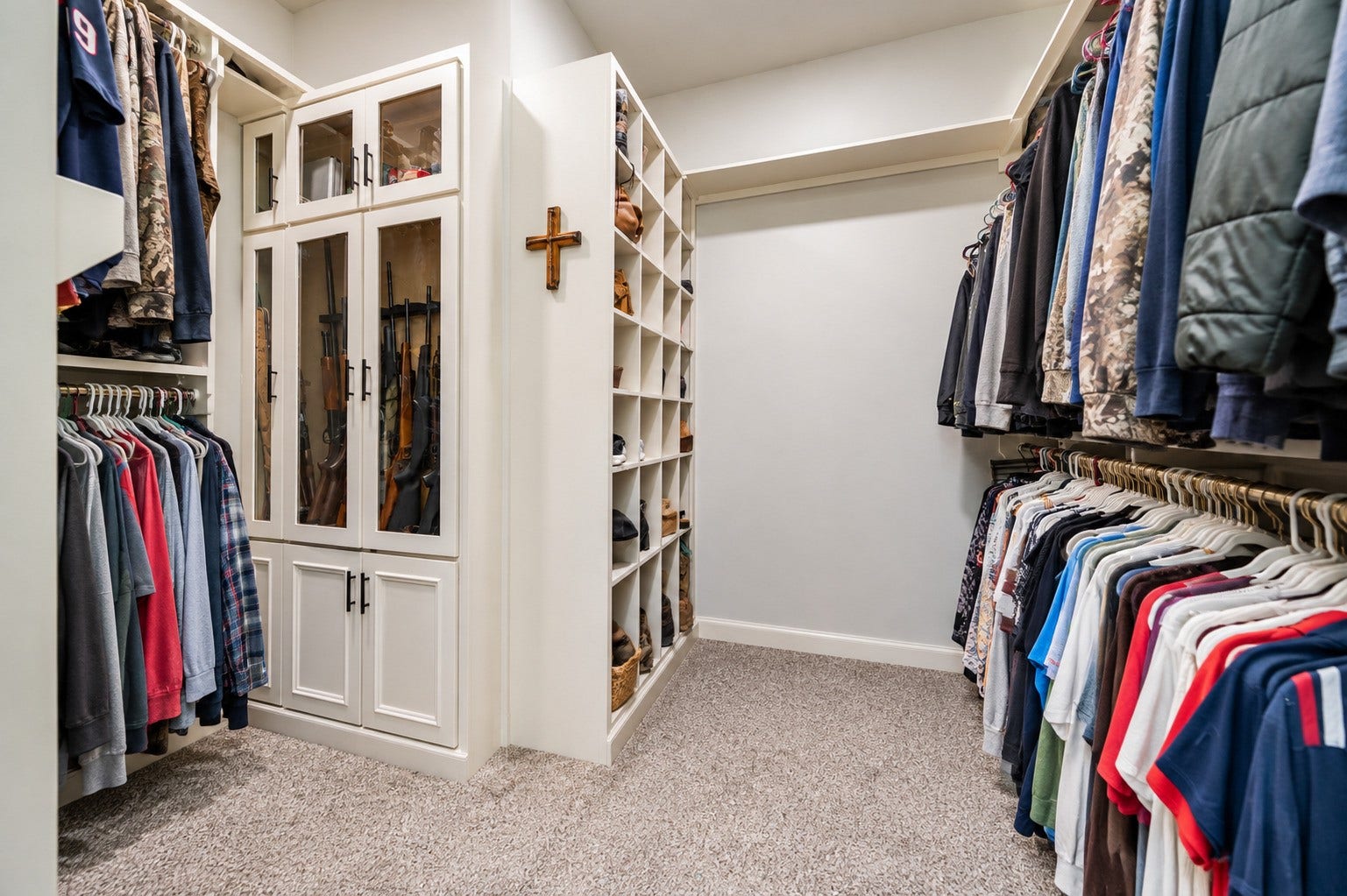 3295 Fm 524 Road, Sweeny, TX 77480 Large primary walk-in closet with built-in shelving and hanging space. This photo may be edited using AI tools.