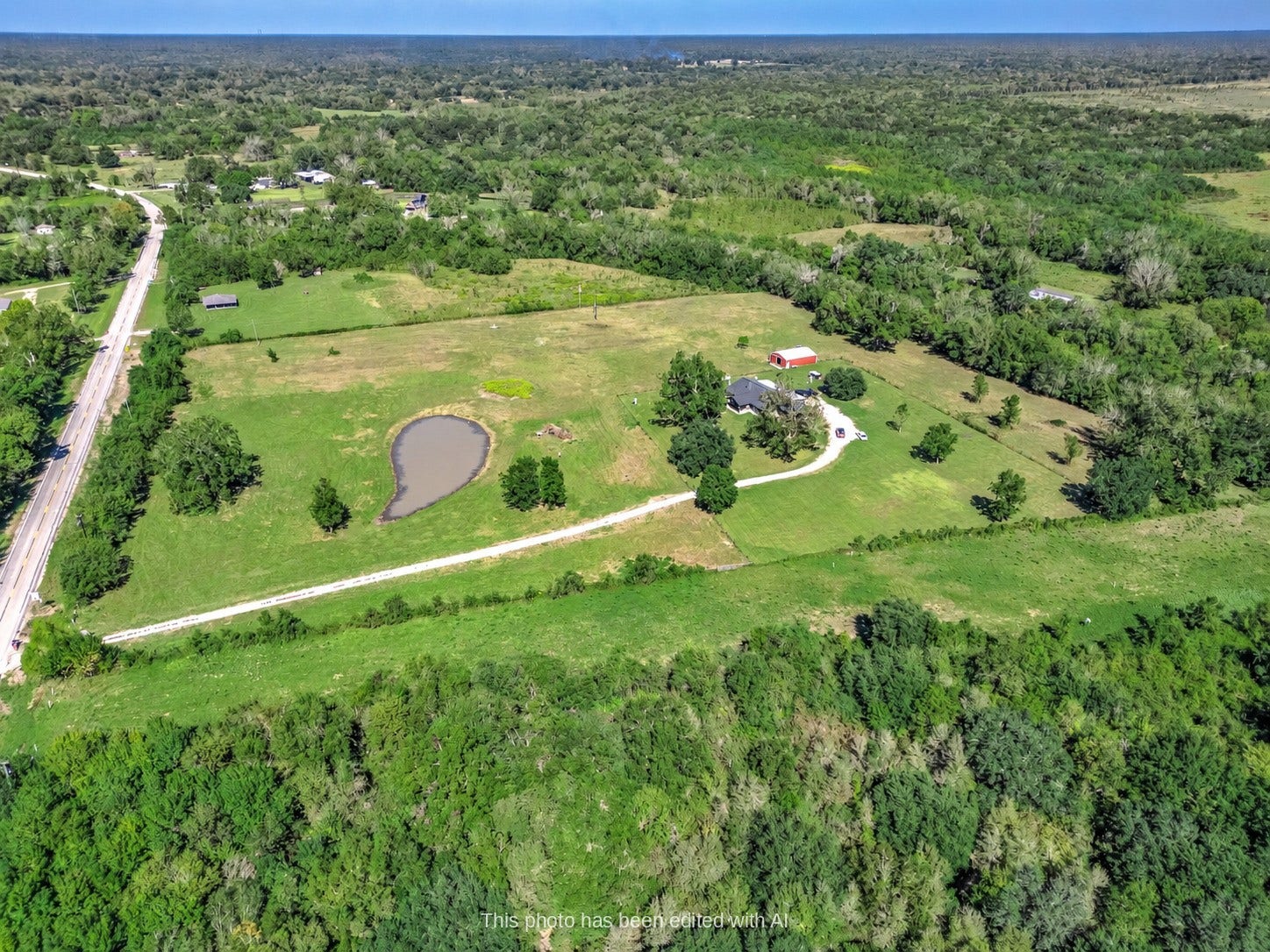 3295 Fm 524 Road, Sweeny, TX 77480 Aerial view of the 15.9-acre Sweeny property showing the pond, pasture, home and gravel drive off FM 524. This photo may be edited using AI tools.