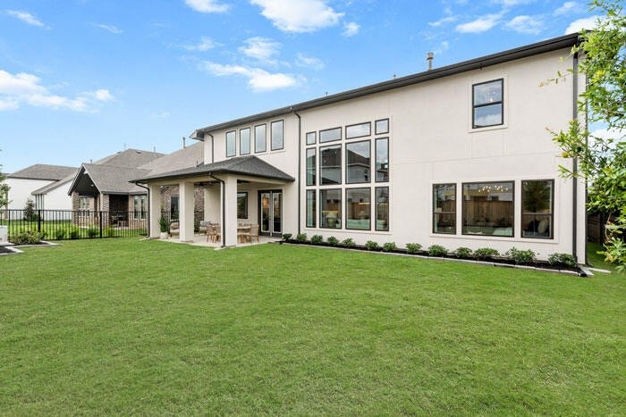 7114 Quaker Meadows Drive, Katy, TX 77493 Additional space for entertaining on the covered patio. Representative image.