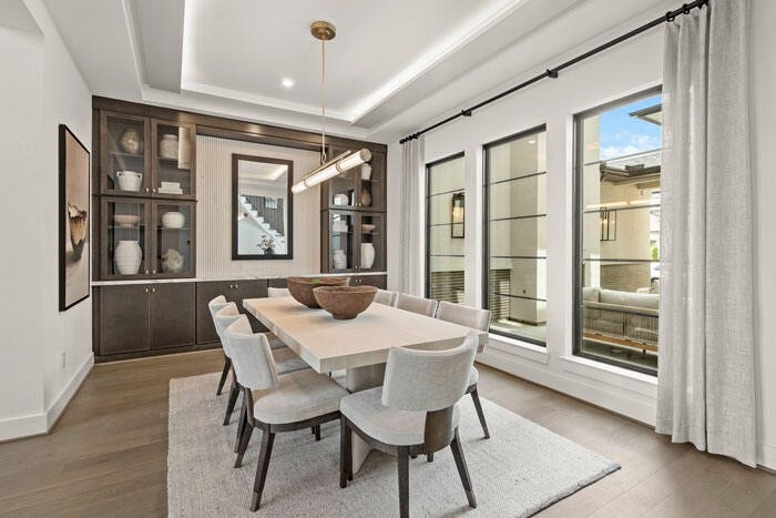 7114 Quaker Meadows Drive, Katy, TX 77493 Here you can see the formal dining room which overlooks the courtyard. Representative image.