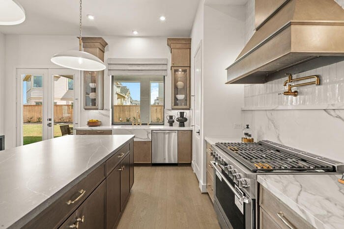 7114 Quaker Meadows Drive, Katy, TX 77493 The gourmet kitchen with a sink that overlooks your covered patio. Representative image.