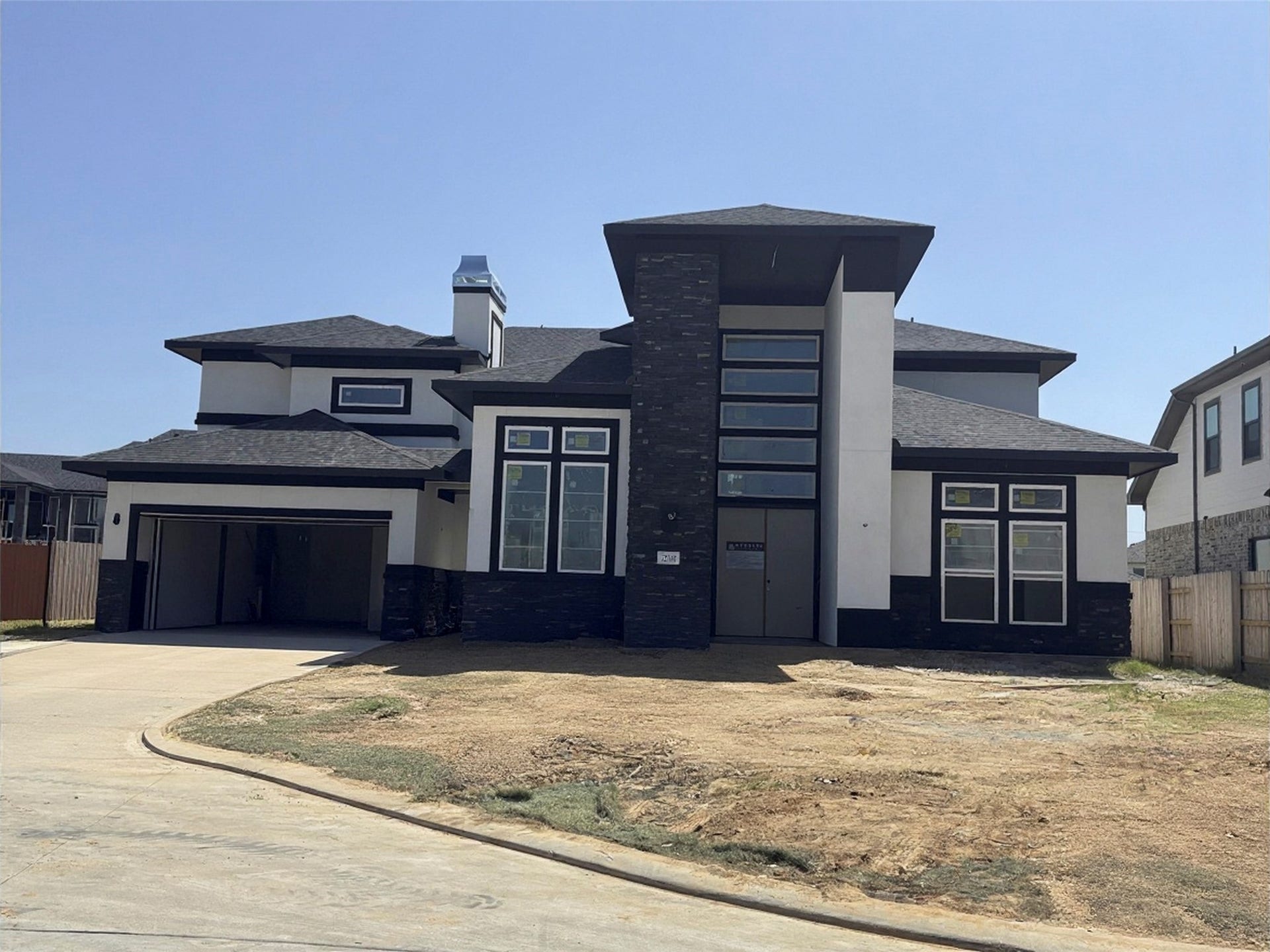 7114 Quaker Meadows Drive, Katy, TX 77493 Work in progress, the dramatic elevation rendered in black and white is a showstopper
