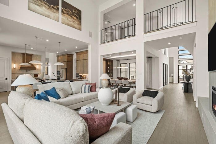 7114 Quaker Meadows Drive, Katy, TX 77493 Plenty of light and space to gather in the family room. Representative image.