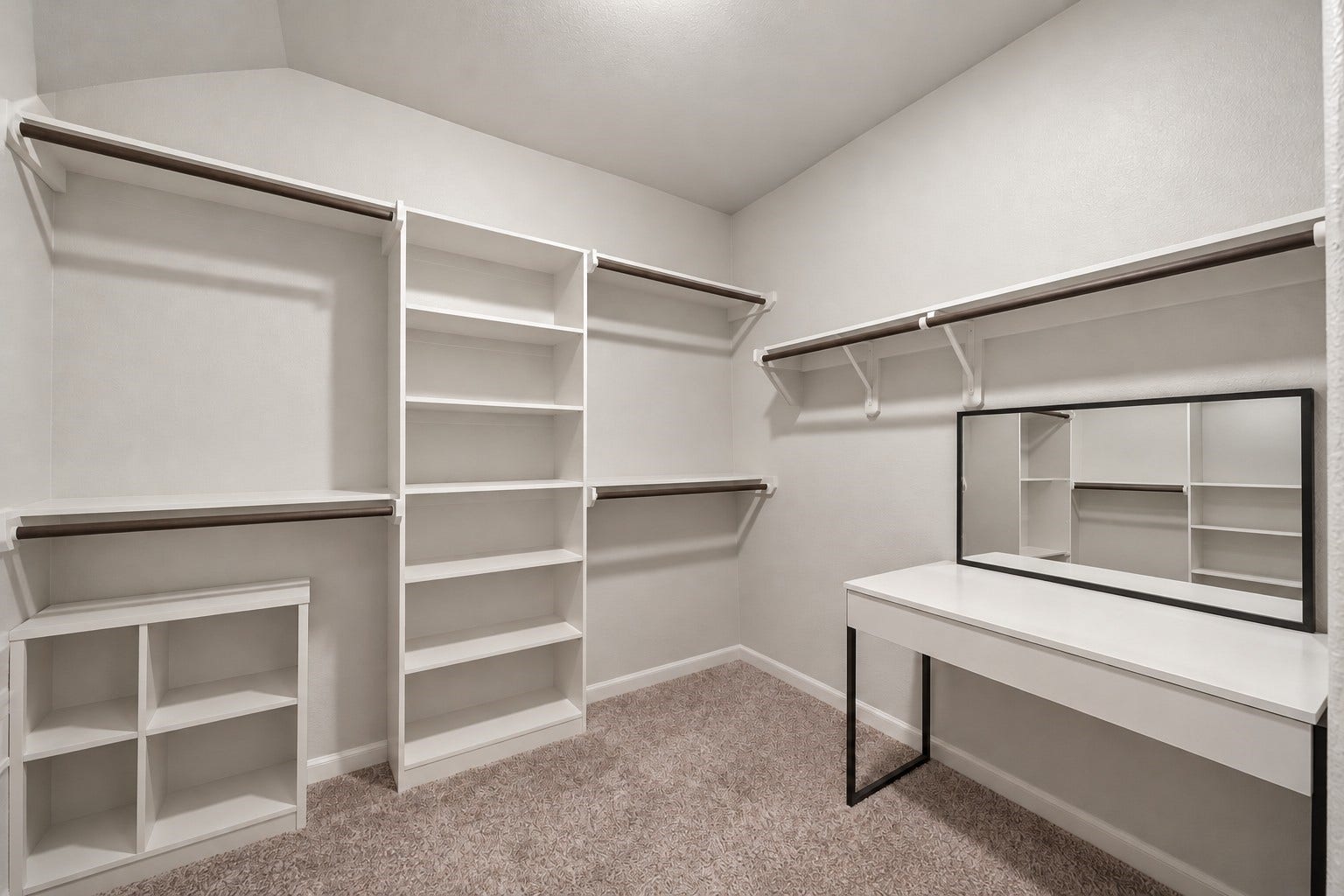 903 Pismo Lane, Rosharon, TX 77583 Virtually Enhanced: This spacious walk-in primary closet features a functional layout with generous storage capacity and an open, accessible design. Multiple walls offer built-in shelving and hanging rods at varying heights, providing ample space for clothing, shoes, and accessories.
