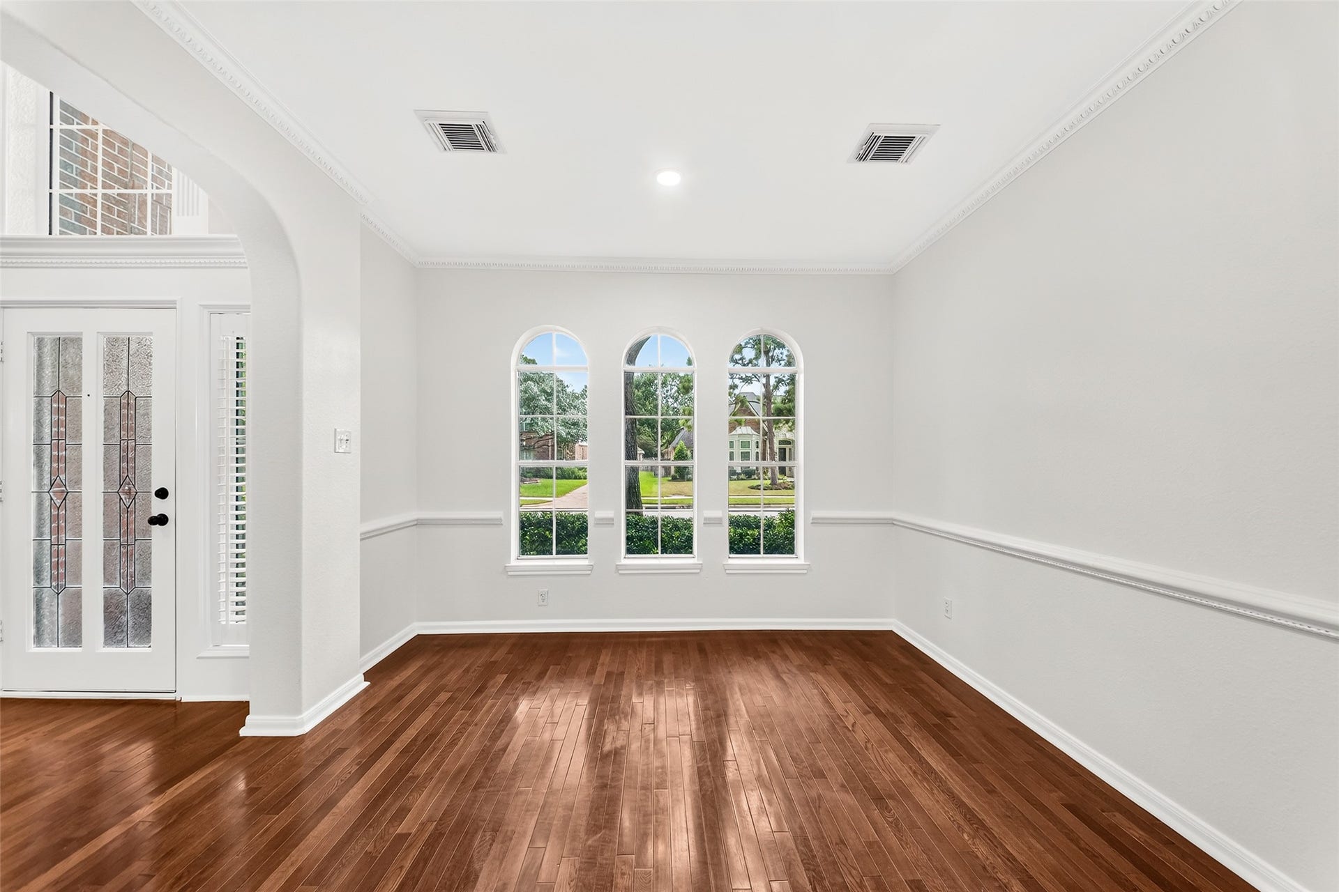 9515 Sotherloch Lake Drive, Spring, TX 77379 Formal living room or private study - arched windows add an extra layer of architectural detail.