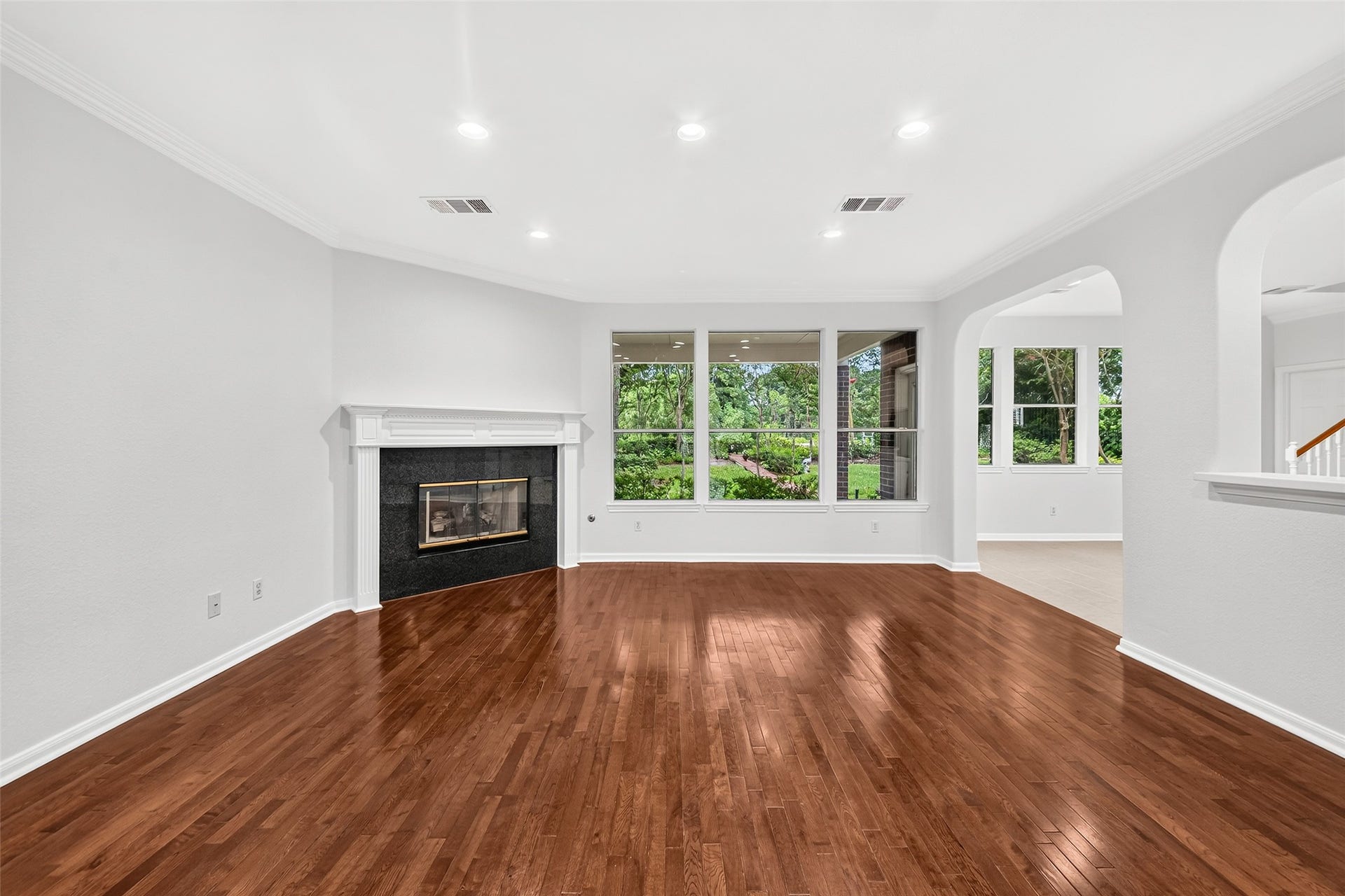 9515 Sotherloch Lake Drive, Spring, TX 77379 The family room offers beautiful views of the lushly landscaped back yard, and the lake beyond.