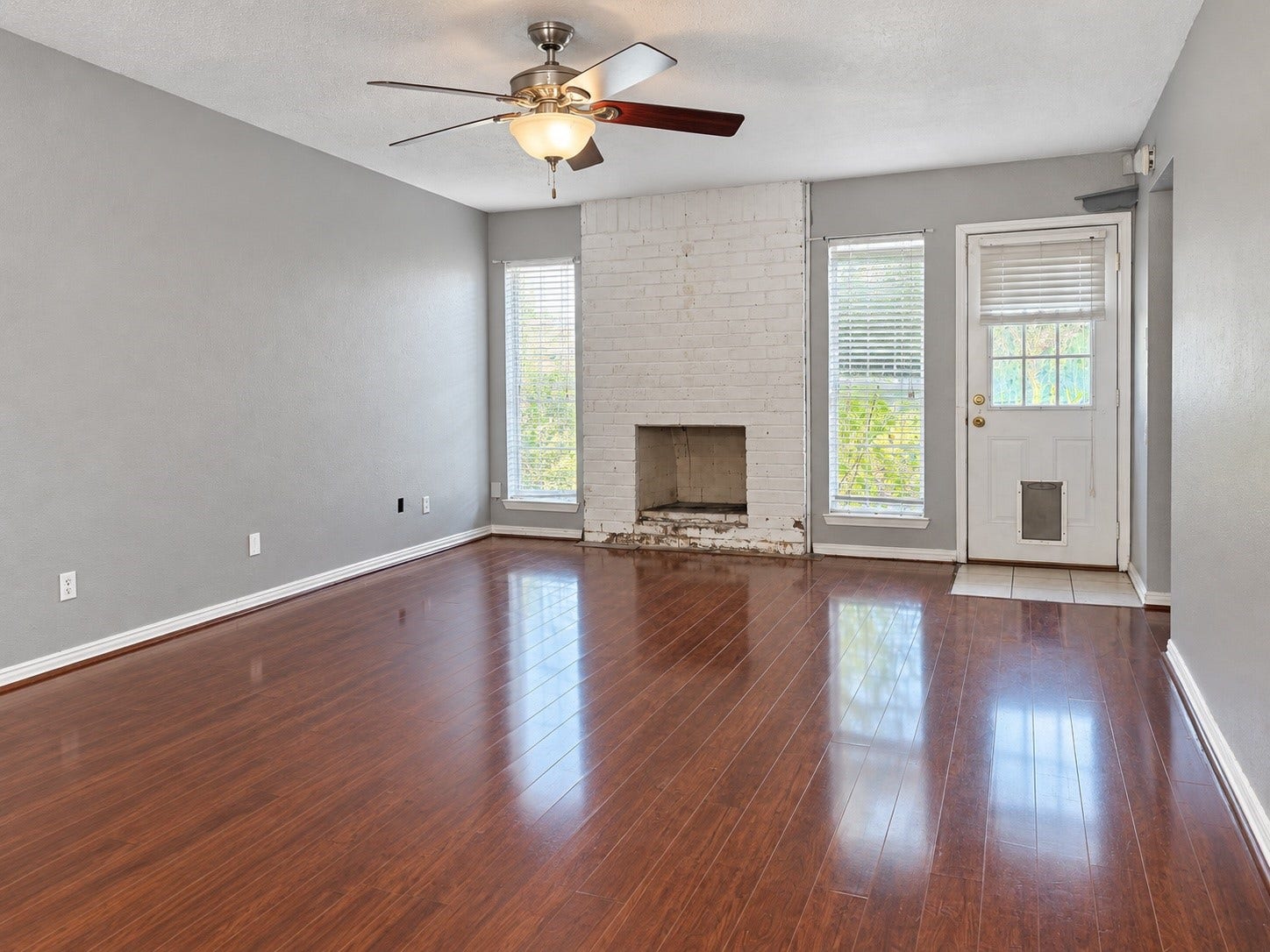 7407 Woodnettle Lane, Houston, TX 77086 Living area with wood burning fireplace