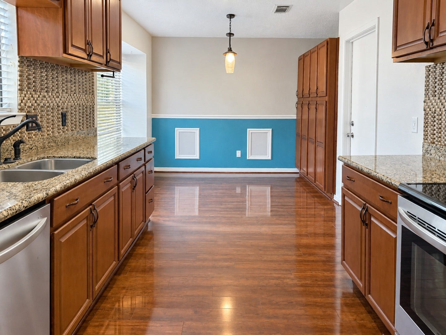 7407 Woodnettle Lane, Houston, TX 77086 Kitchen offers beautiful cabinetry and upgraded stainless tell appliances