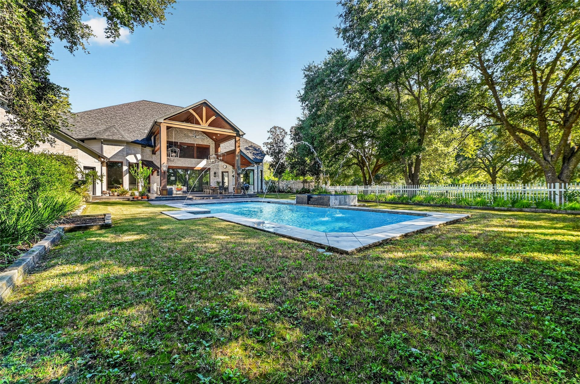 4510 River Forest Drive, Richmond, TX 77406 The exterior of the home is surrounded by lush landscaping and an abundance of trees. No neighbors on any side makes this the ultimate private retreat.