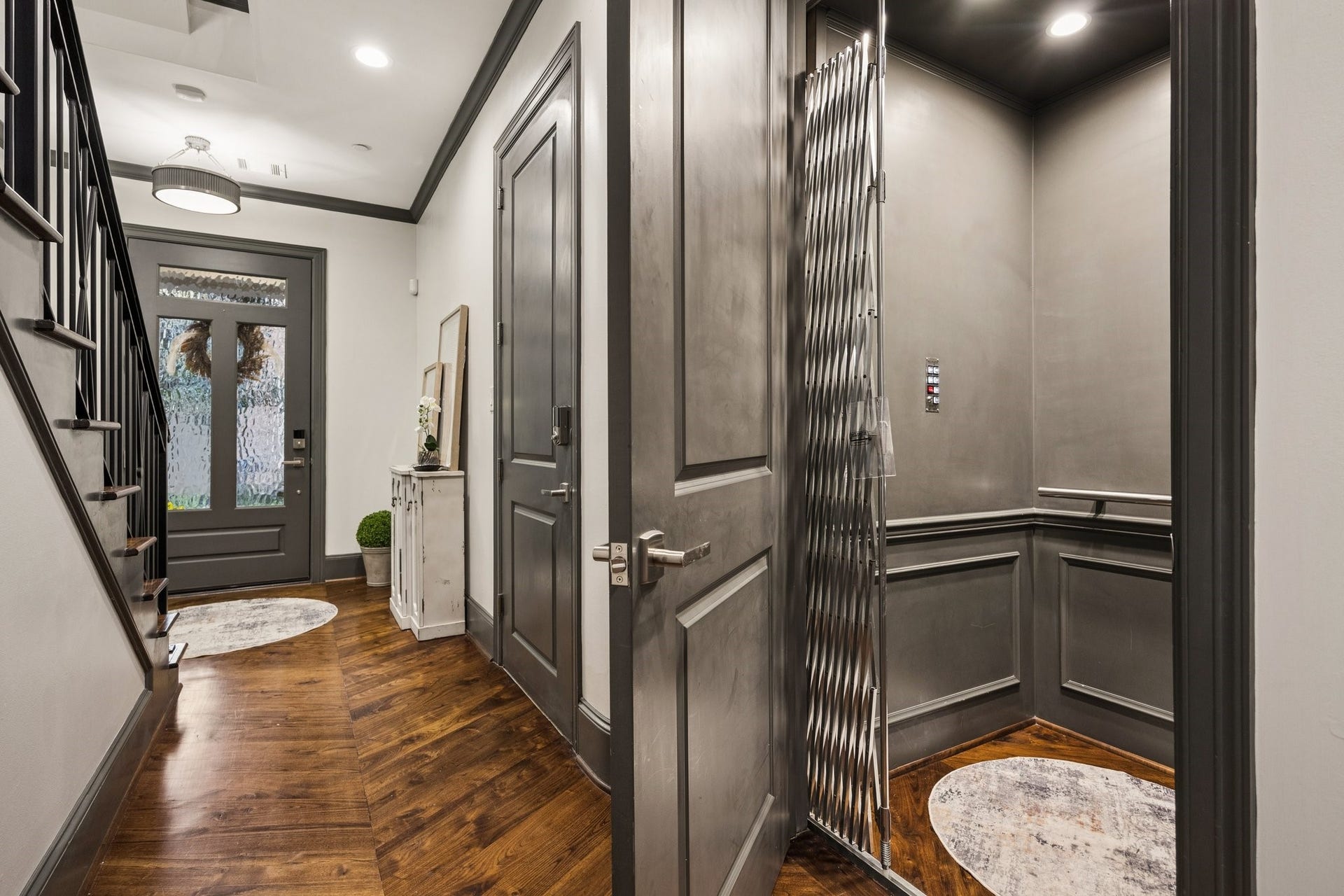 2131 Bancroft Street, Houston, TX 77027 Elegant first-floor foyer featuring rich hardwood floors, custom millwork, and a private elevator providing effortless access to all four levels.
