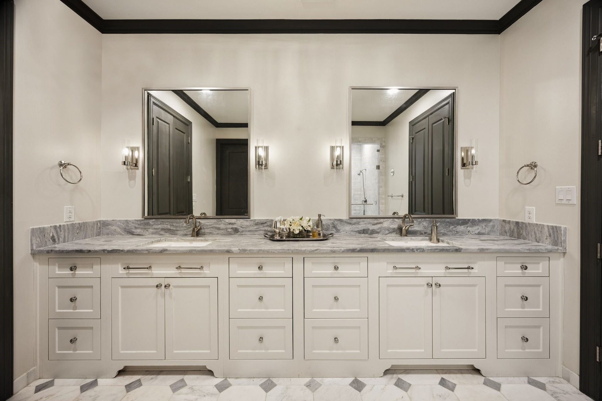 2131 Bancroft Street, Houston, TX 77027 Beautifully designed double vanity with elegant marble countertops, custom cabinetry offering generous storage, and dual sinks.