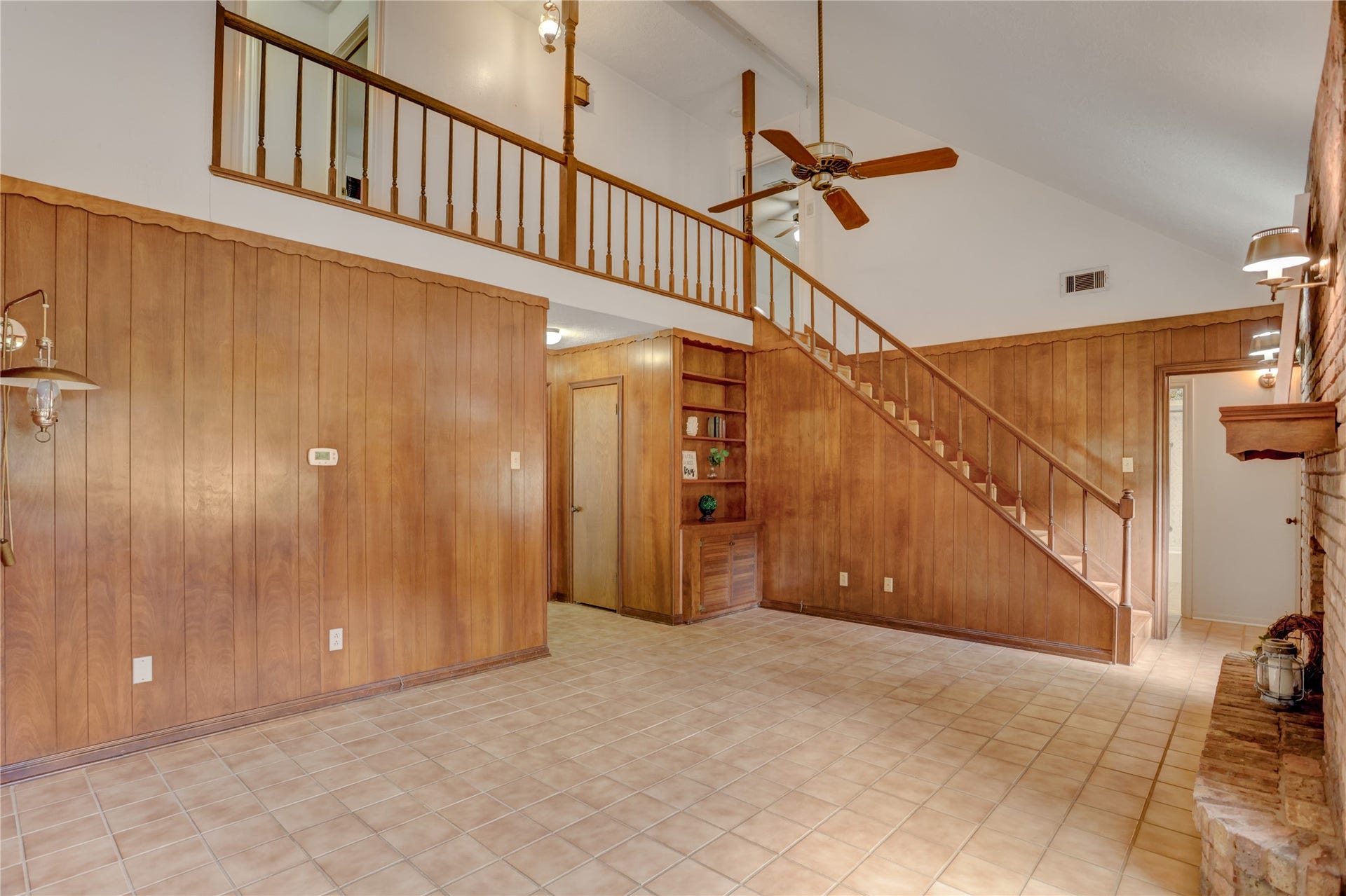 105 Hillcrest Drive, Alvin, TX 77511 Den and stairs leading to 3 bedrooms and full bath